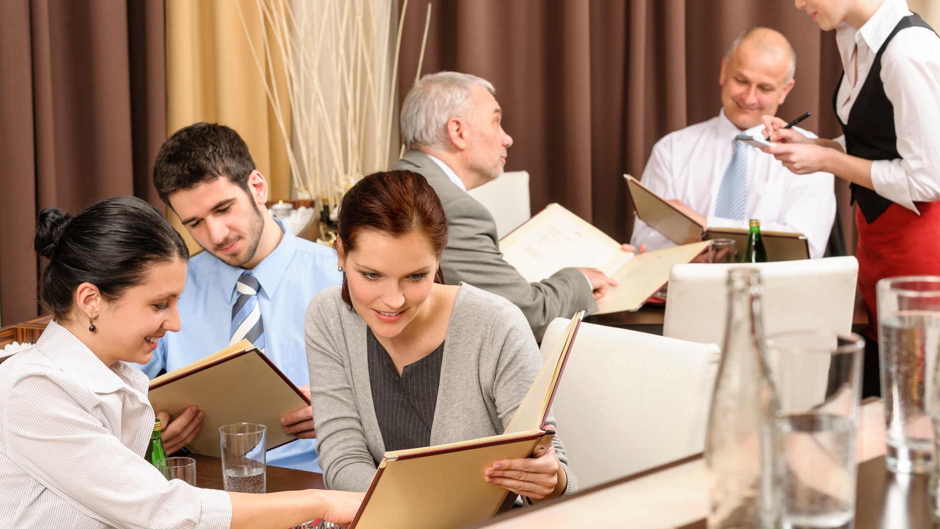 Business lunch executive people looking menu ordering meal at restaurant