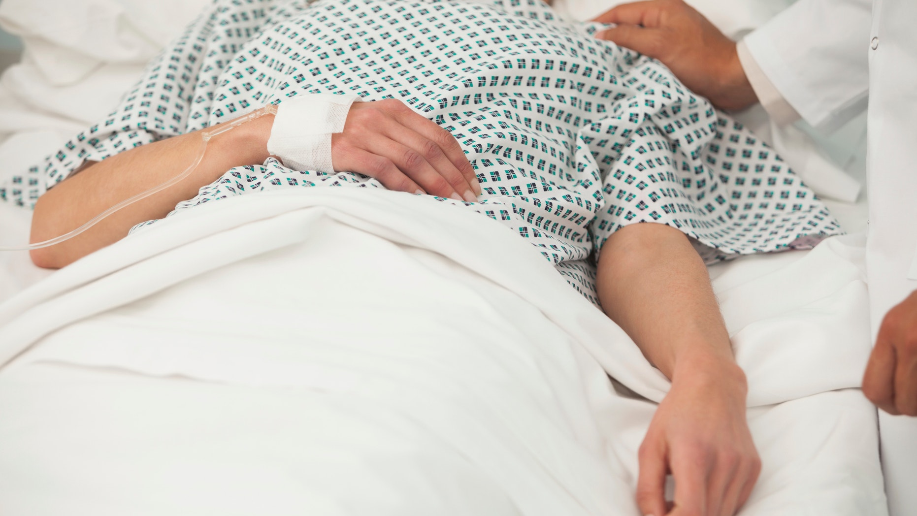 Old sick lady lying in hospital bed