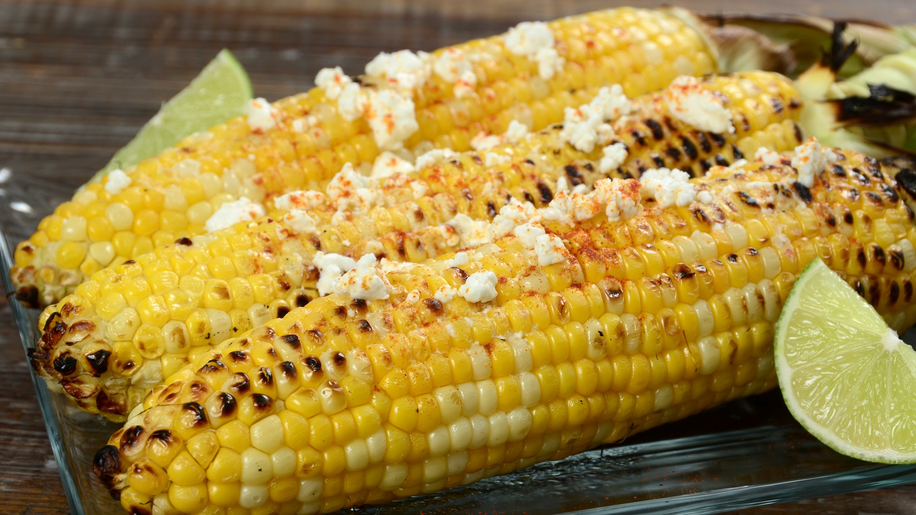 Elote or Mexican grilled corn on the cob served with cotija cheese and chili powder.