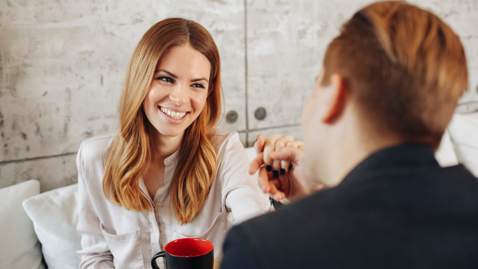 Young couple dating in cafe