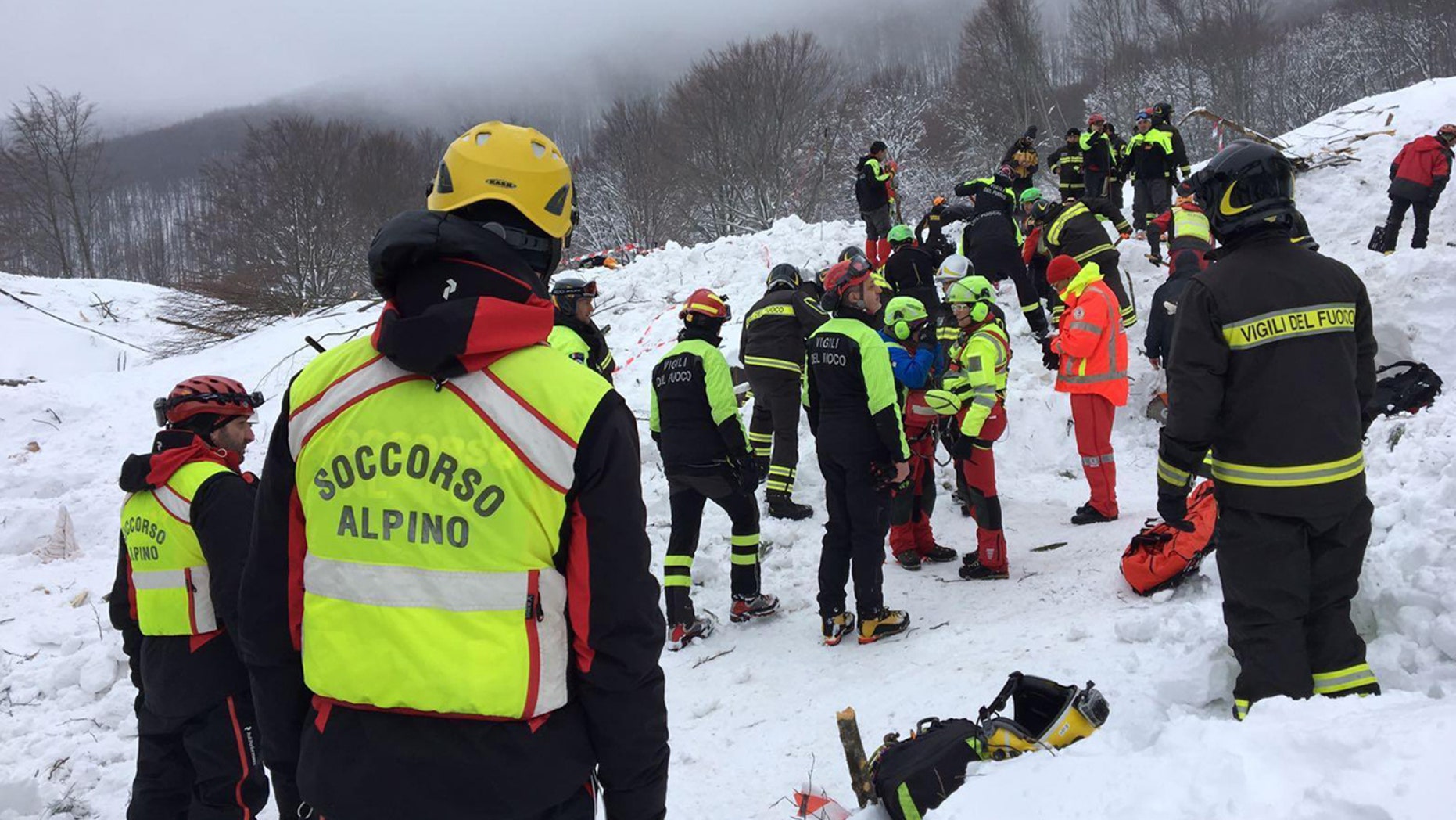 Rescuers work in the area of the avalanche-hit Rigopiano hotel, Saturday, Jan. 21, 2017.