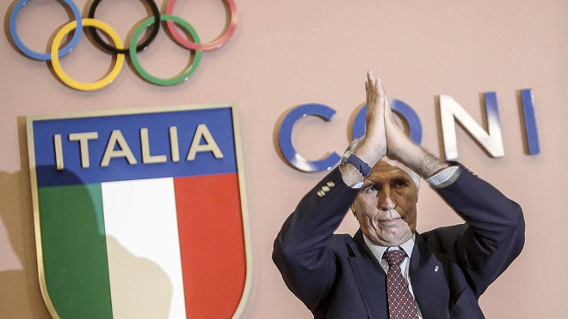 In this Wednesday, Sept. 21, 2016 file photo, CONI (Italian Olympic Committee) President Giovanni Malago' applauds during a press conference at the CONI headquarters in Rome.