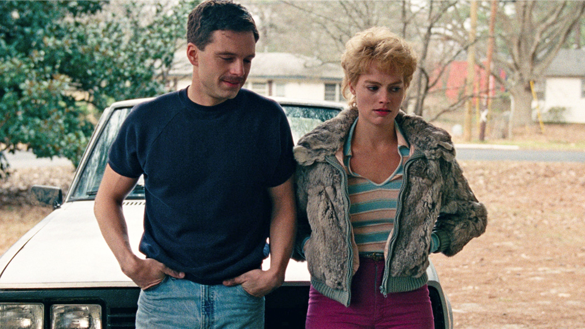 This image released by Neon shows Sebastian Stan as Jeff Gillooly, left, and Margot Robbie as Tonya Harding in a scene from "I, Tonya." On Monday, Dec. 11, 2017, Robbie was nominated for a Golden Globe for best actress in a motion picture comedy or musical for her role in the film.