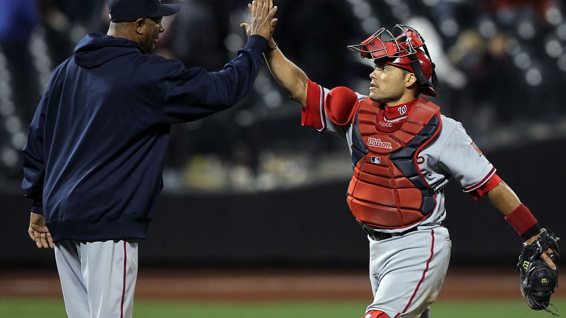 2010: Ivan Rodriguez #7 and Livan Hernandez #61 of the Washington Nationals (Photo by Jim McIsaac/Getty Images)