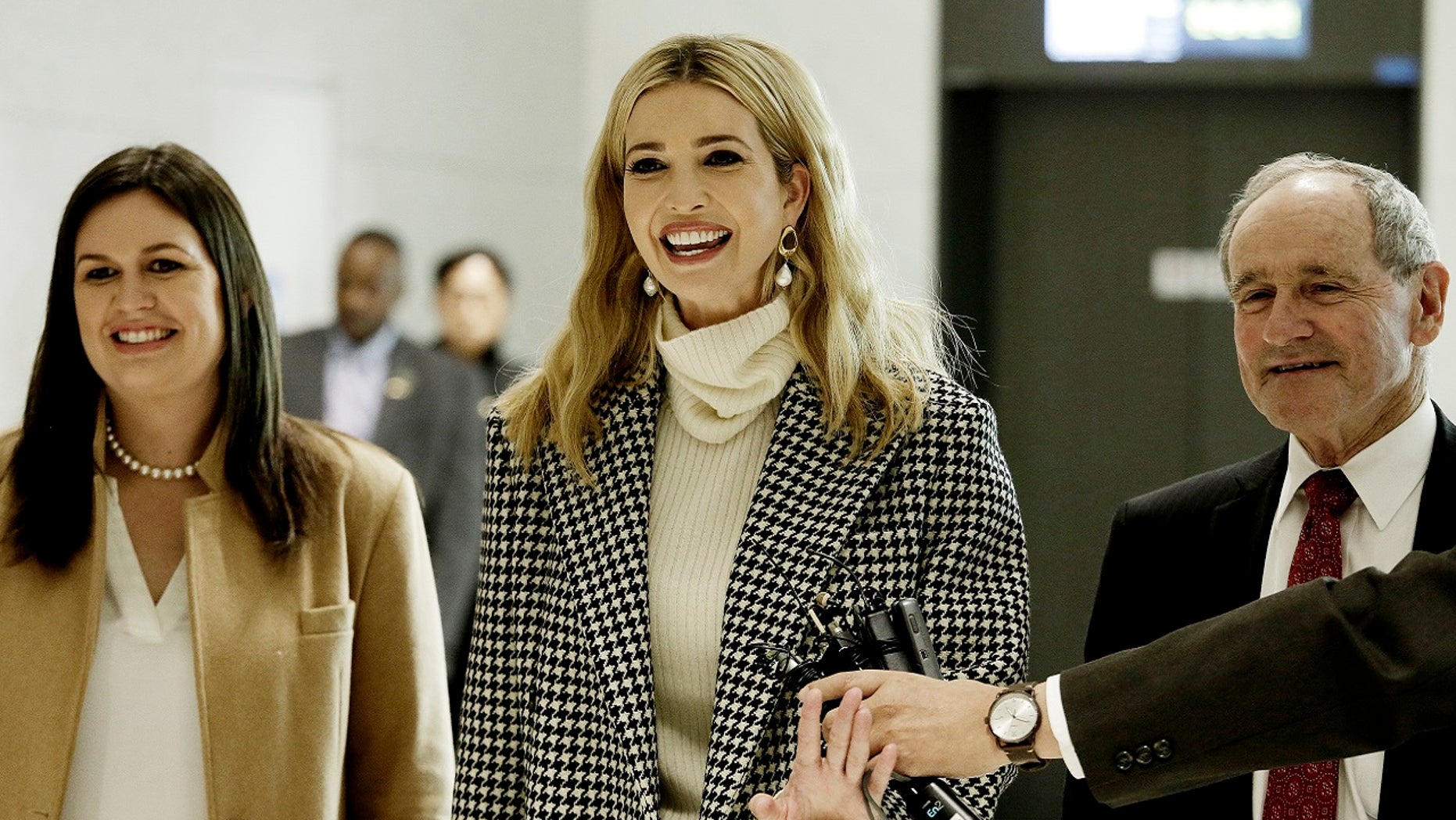 Ivanka Trump, daughter of U.S. President Donald Trump, arrives at the Incheon International Airport in Incheon, South Korea, Feb. 23, 2018. At left is White House press secretary Sarah Sanders.