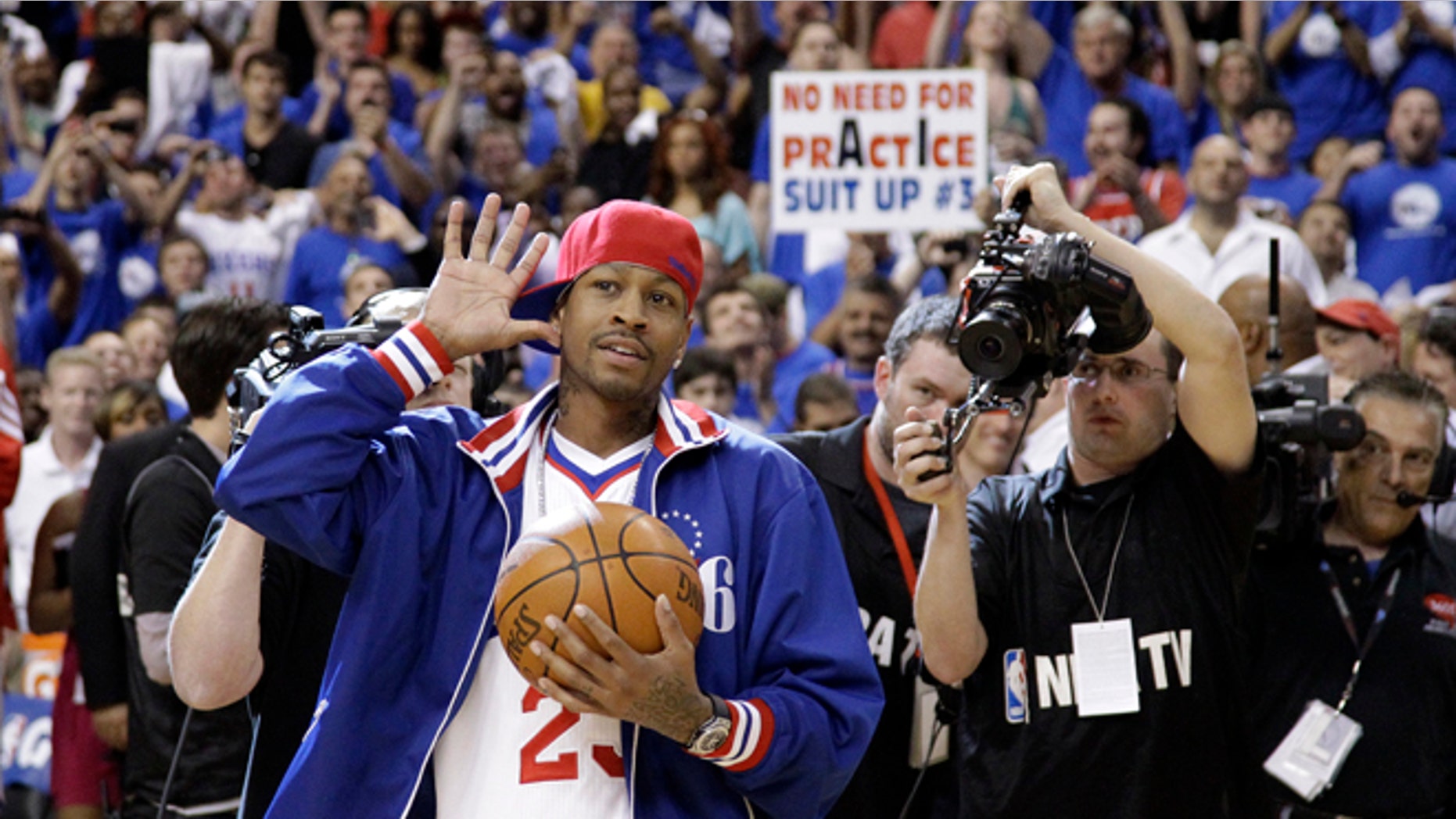 Former Philadelphia 76er Allen Iverson acknowledges the crowd as he brings in the game ball before Game 6 of an NBA basketball Eastern Conference semifinal playoff series between the 76ers and the Boston Celtics, Wednesday, May 23, 2012, in Philadelphia. (AP Photo/Matt Slocum)