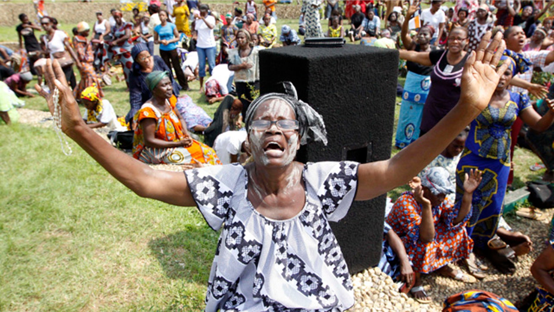 Dec. 27: A member of the Ivory Coast Christian Women Association prays for peace in Abidjan. Fears of a regional military intervention grew Monday in Ivory Coast following a threat from West African neighbors to force out incumbent leader Laurent Gbagbo if he does not soon heed international calls to step down from power. (AP)