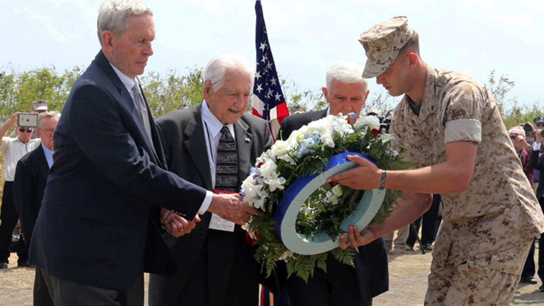 Mar. 21, 2015: U.S. veterans offer a wreath during a ceremony commemorating the 70th anniversary of the Battle of Iwo Jima on Iwo Jima, now known officially as Ioto, Japan. (AP)