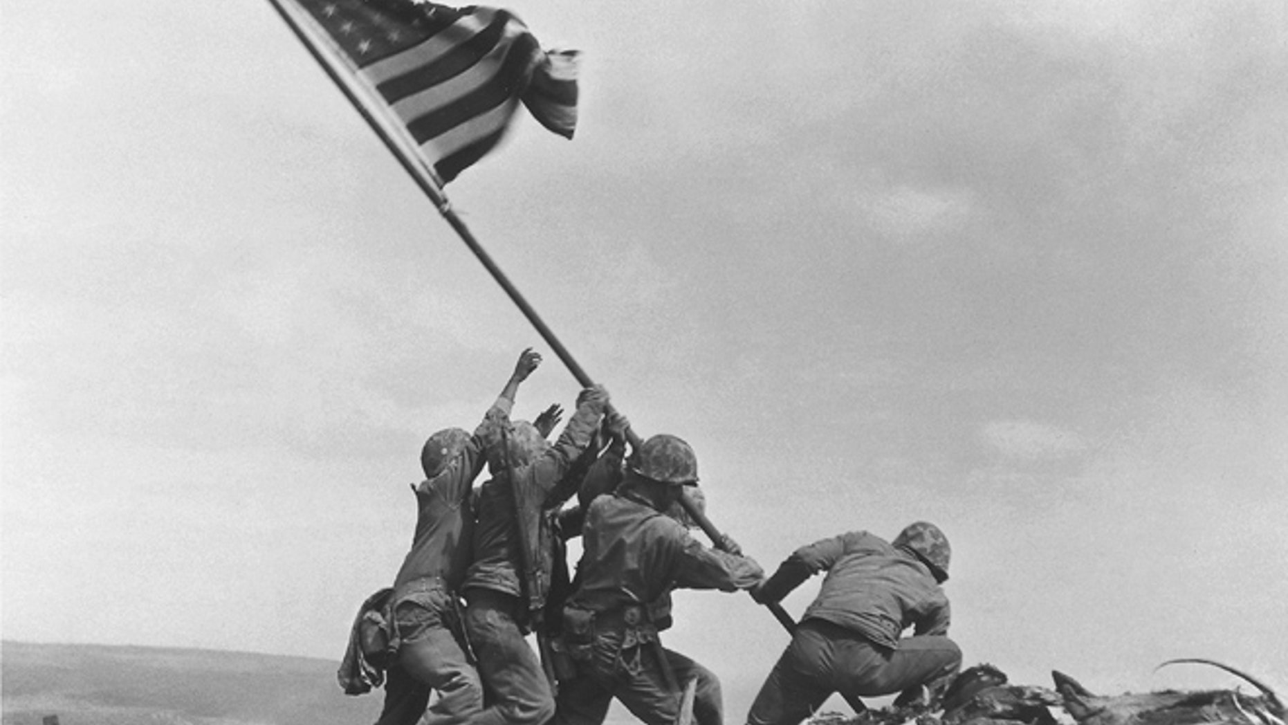 FILE - In this Feb 23, 1945 file photo, U.S. Marines of the 28th Regiment, 5th Division, raise the American flag atop Mt. Suribachi, Iwo Jima, Japan. (AP)