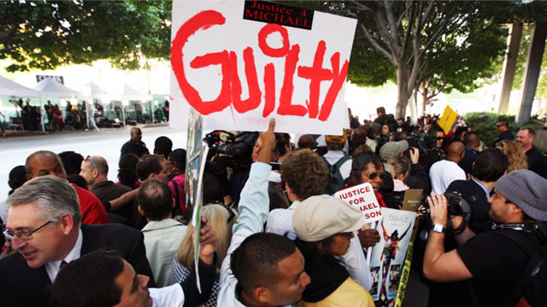Nov. 7, 2011: Michael Jackson fans celebrate outside the courtroom.