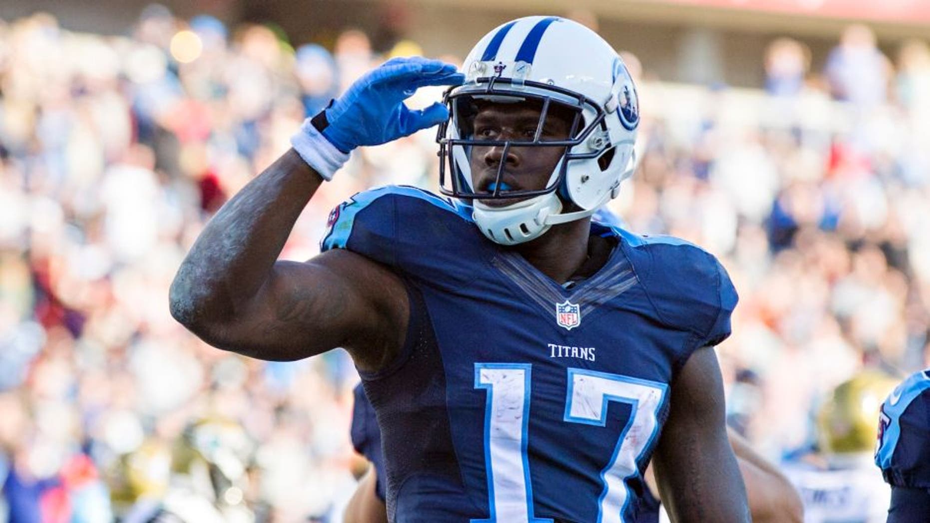 NASHVILLE, TN - DECEMBER 6: Dorial Green-Beckham #17 of the Tennessee Titans salutes the crowd after scoring a touchdown against the Jacksonville Jaguars at Nissan Stadium on December 6, 2015 in Nashville, Tennessee. The Titans defeated the Jaguars 42-39. (Photo by Wesley Hitt/Getty Images)