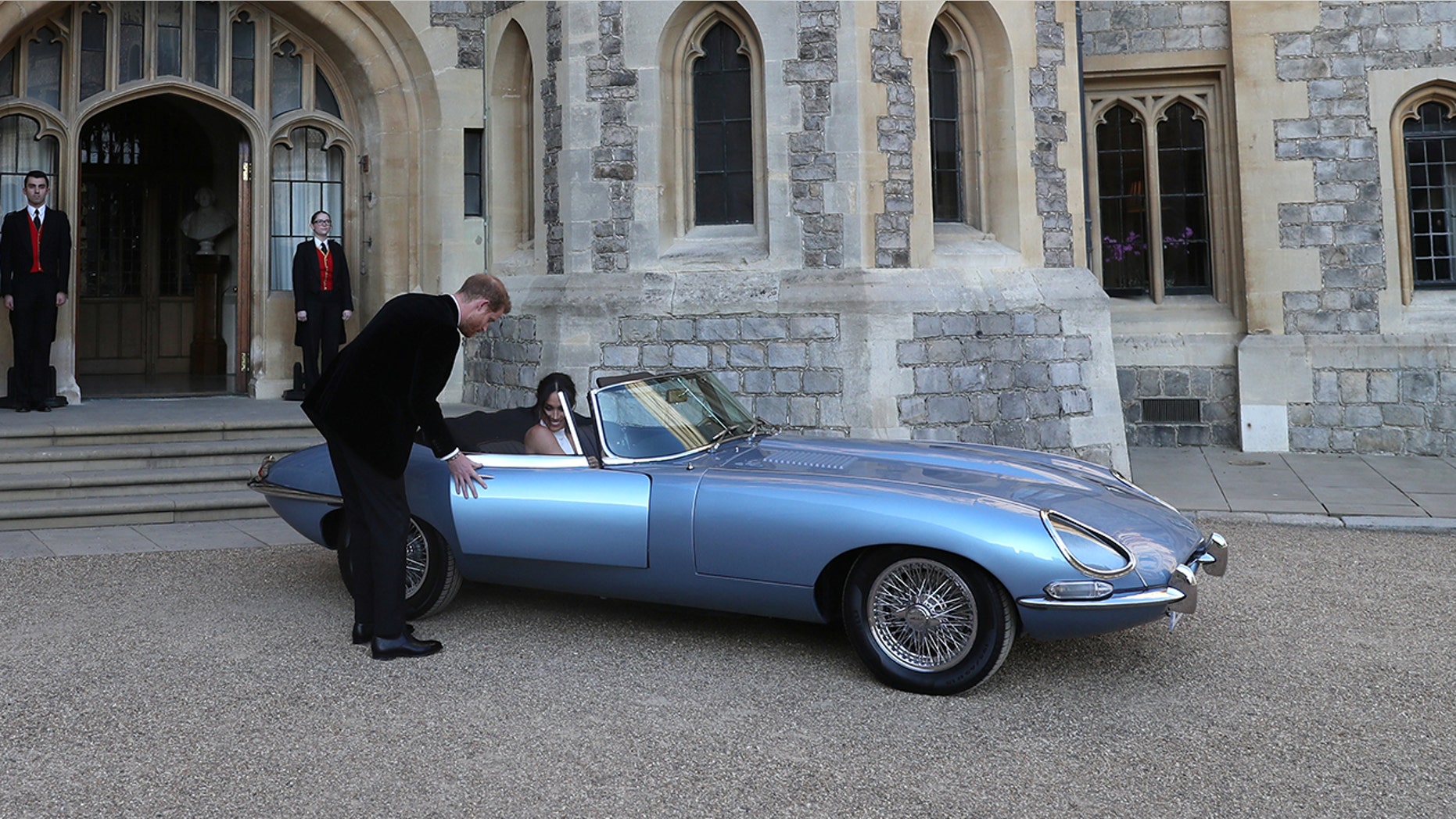 The newly married Duke and Duchess of Sussex, Meghan Markle and Prince Harry, leaving Windsor Castle after their wedding to attend an evening reception at Frogmore House, hosted by the Prince of Wales Windsor, Britain, May 19, 2018. Steve Parsons/Pool via REUTERS - RC1C6E02A820