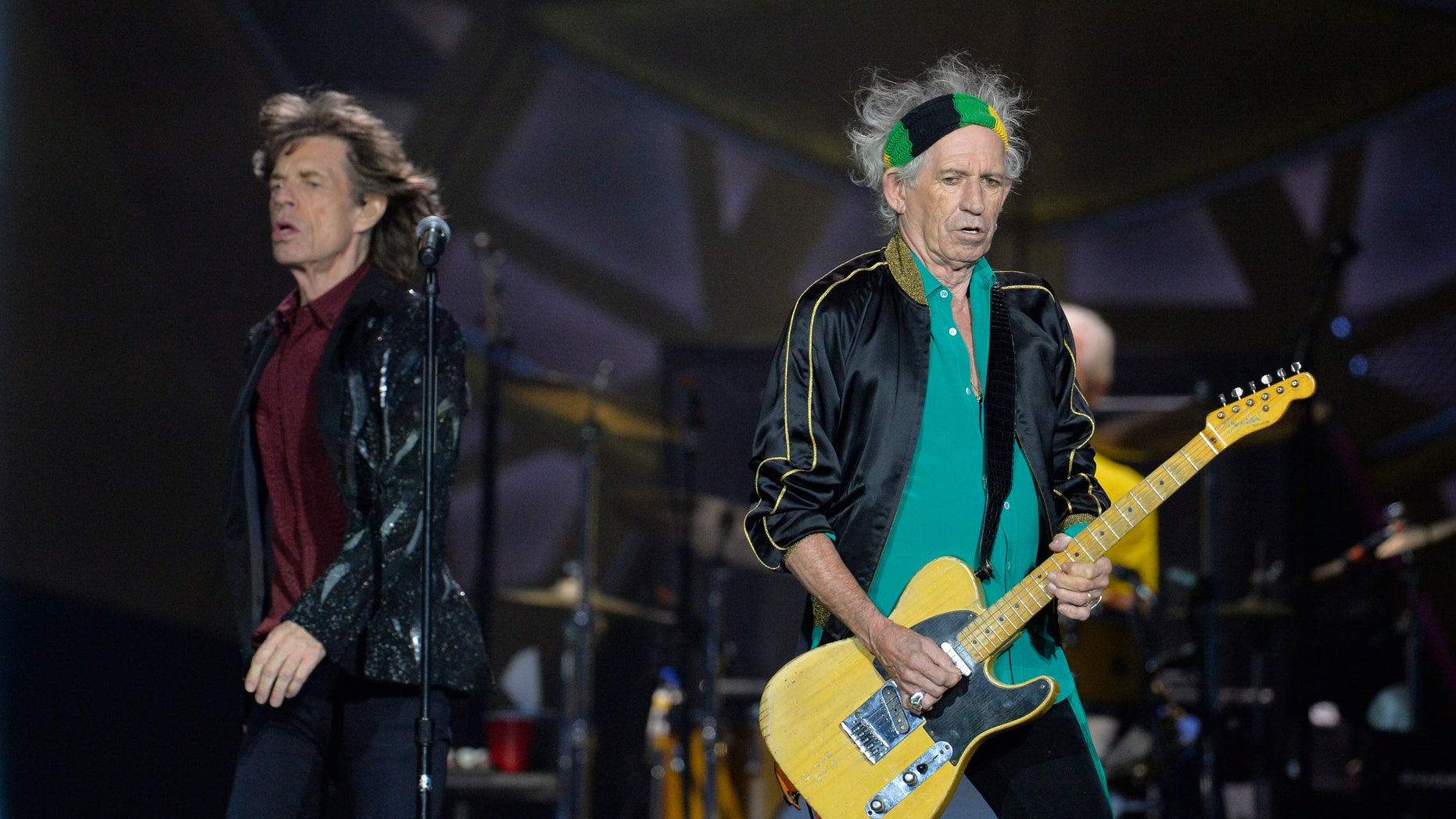July 1, 2014. Mick Jagger (L) and guitarist Keith Richards of British rock band The Rolling Stones perform during a concert at the Tele2 arena in Stockholm.
