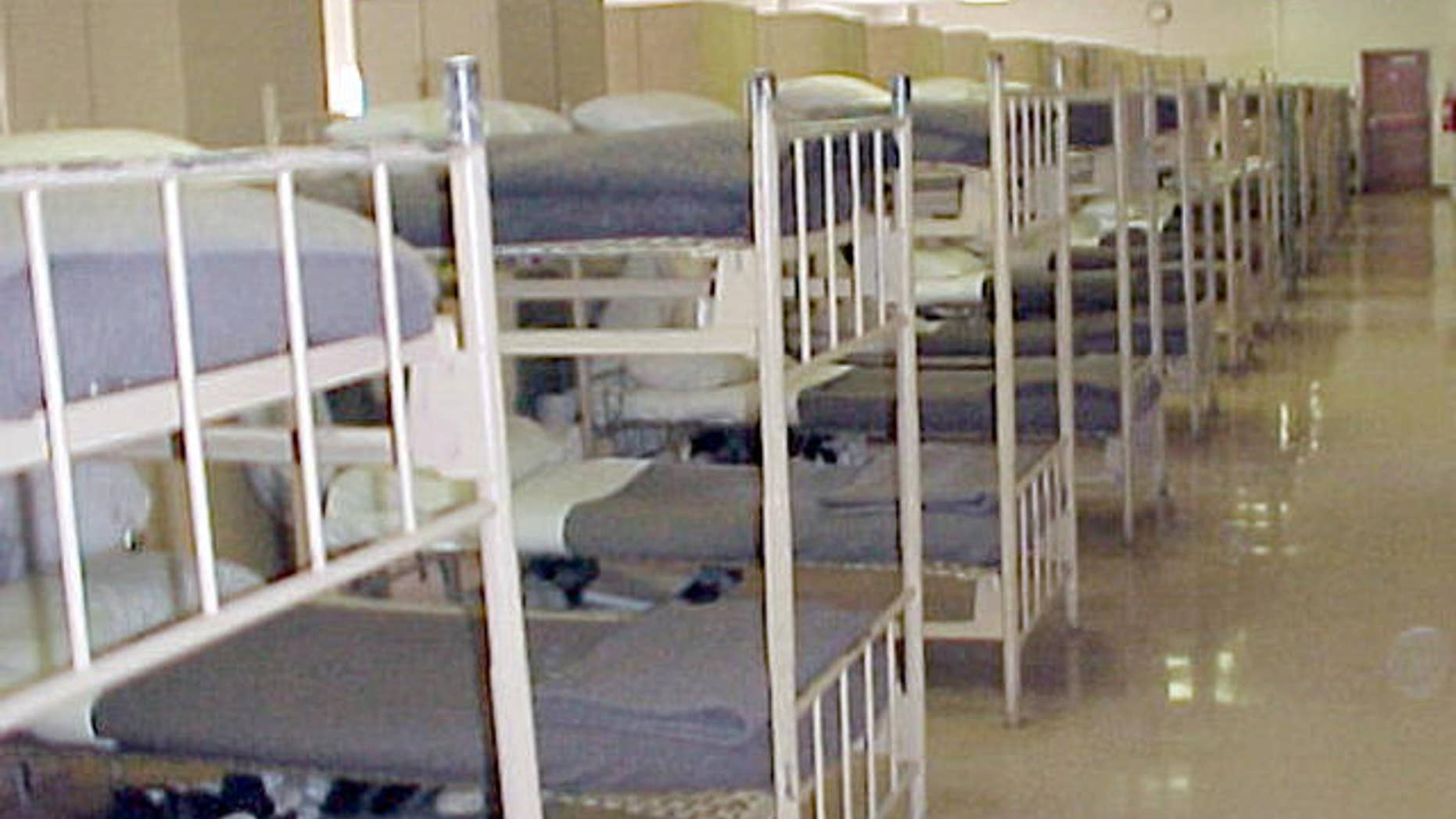 In this undated handout photo provided by the Bureau of Prisons, beds are lined up in a dormitory of the Bastrop Federal Correctional Institution, a low- and minimum-security prison about 30 miles southeast of Austin in Bastrop, Texas. Former Enron Corp. executive Richard Causey reported to the prison Wednesday, Jan. 3, 2007 to begin serving five- and-a-half years for his role in the company's scandalous collapse. (AP Photo/Bureau of Prisons)