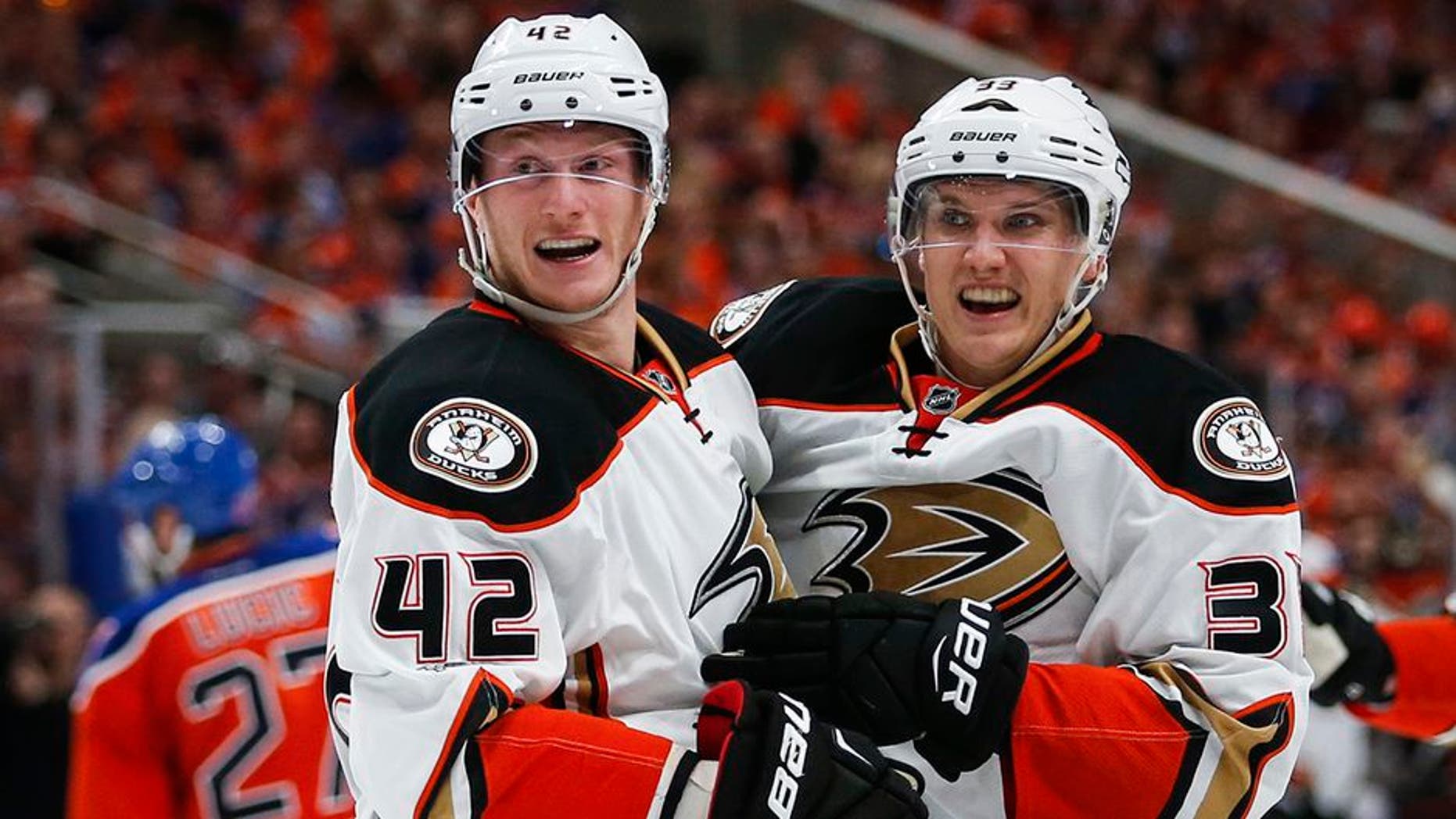 Anaheim Ducks' Jakob Silfverberg, right, from Sweden, celebrates his goal with teammate Josh Manson during the third period of Game 3 in a second-round NHL hockey Stanley Cup playoff series against the Edmonton Oilers in Edmonton, Alberta, Sunday, April 30, 2017. (Jeff McIntosh/The Canadian Press via AP)