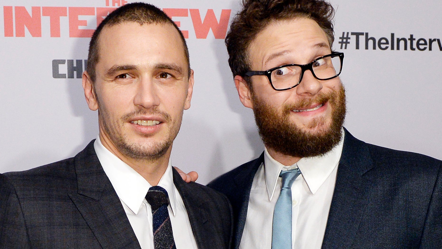 December 11, 2014. Cast members James Franco (L) and Seth Rogen pose during premiere of the film "The Interview" in Los Angeles, California.