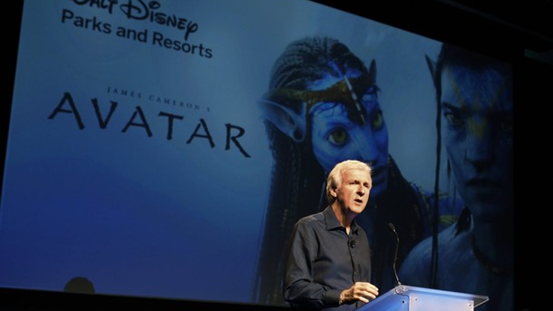 Director James Cameron announce a long-term agreement which will bring "Avatar" themed lands to Disney parks with the the first at Walt Disney World in Orlando, Florida, as he speaks at a media briefing in Glendale, Calfornia September 20, 2011. A scene from "Avatar" is shown on screen background. REUTERS/Fred Prouser (UNITED STATES - Tags: ENTERTAINMENT BUSINESS)