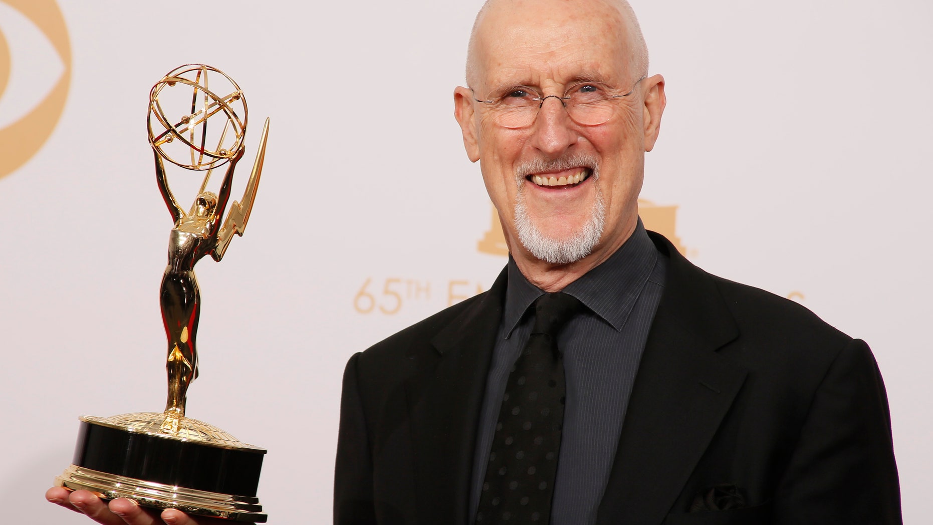 Actor James Cromwell from FX's miniseries "American Horror Story: Asylum" poses backstage with his award for Outstanding Supporting Actor In A Miniseries Or A Movie at the 65th Primetime Emmy Awards in Los Angeles September 22, 2013. REUTERS