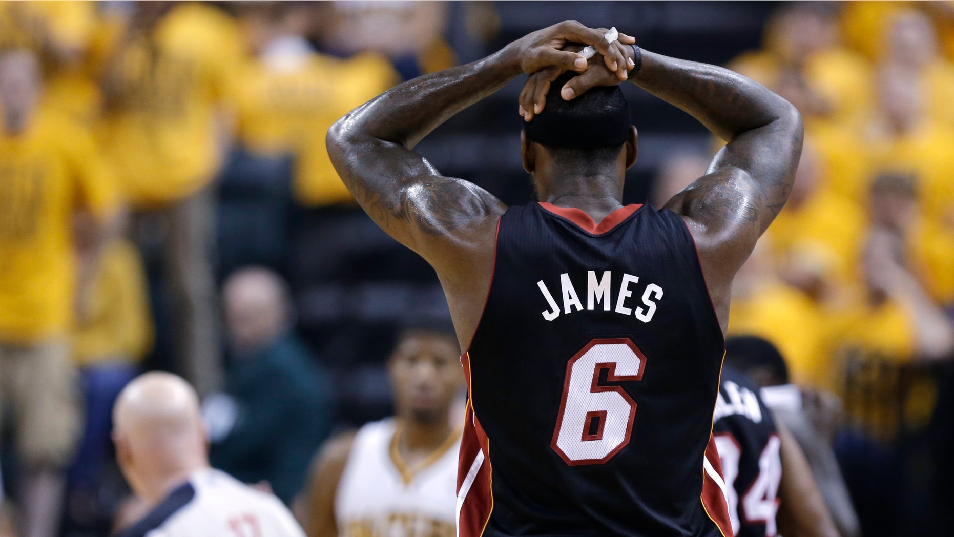 Miami Heat's LeBron James reacts after he was called for a technical foul during the first half against the Indiana Pacers in Game 4 of the NBA basketball Eastern Conference finals, Tuesday, May 28, 2013, in Indianapolis. (AP Photo/Michael Conroy)