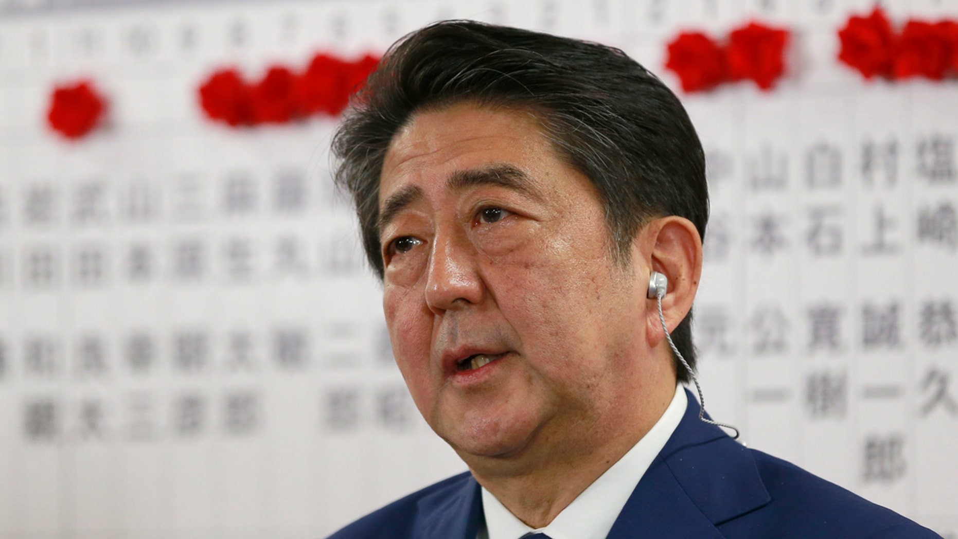 Japanese PM Shinzo Abe, leader of the Liberal Democratic Party, answers questions from a reporter during a TV interview in Tokyo, Sunday, Oct. 22, 2017.