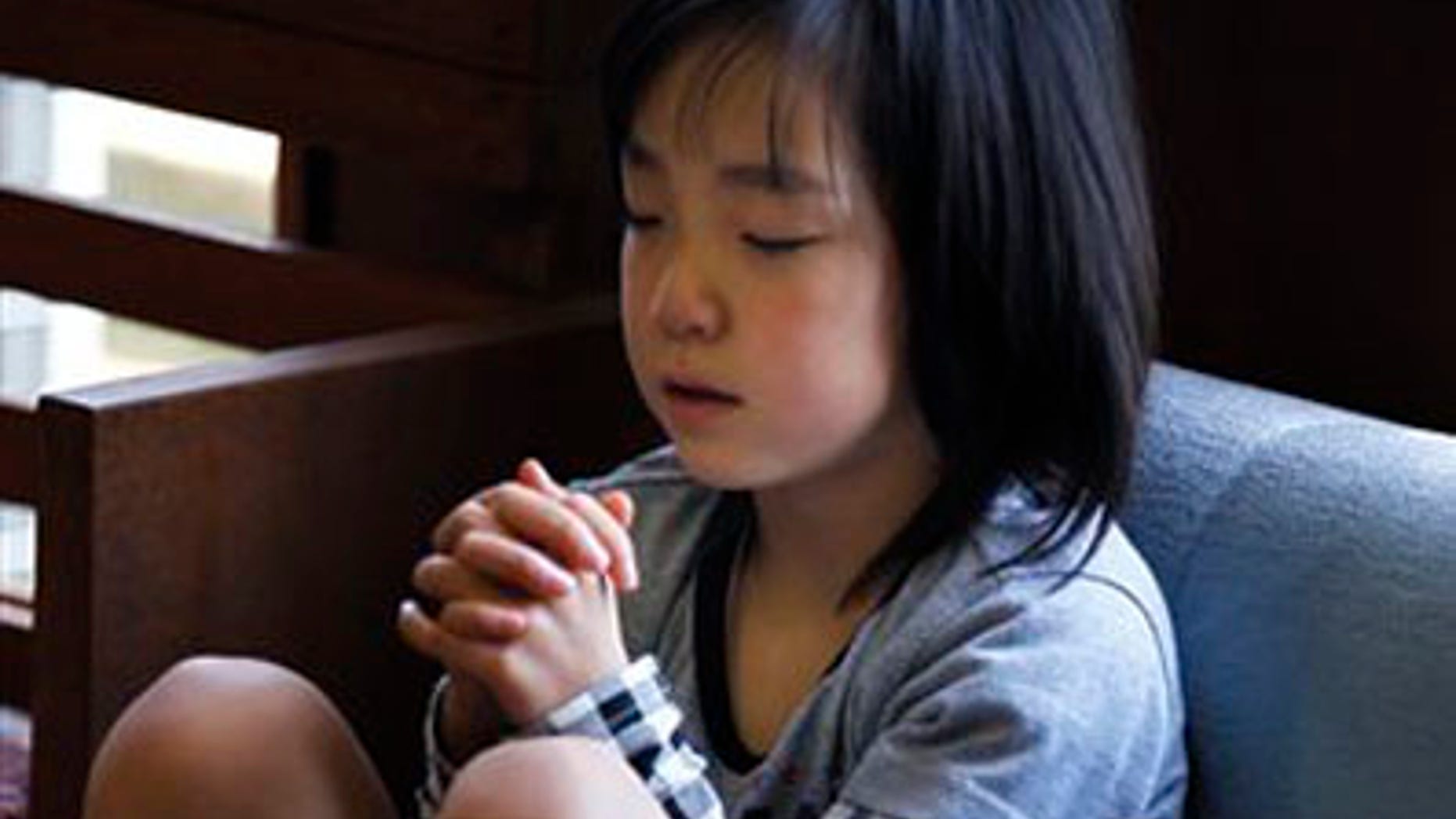 April 24: Renka Hashimoto, 7, prays during the Easter service at Kesennuma Bible Baptist Church in Kesennuma, Miyagi Prefecture, northeastern Japan. This Easter, the story of resurrection carried a deeply personal message for the small community of Christians in disaster-hit Japan. (AP)
