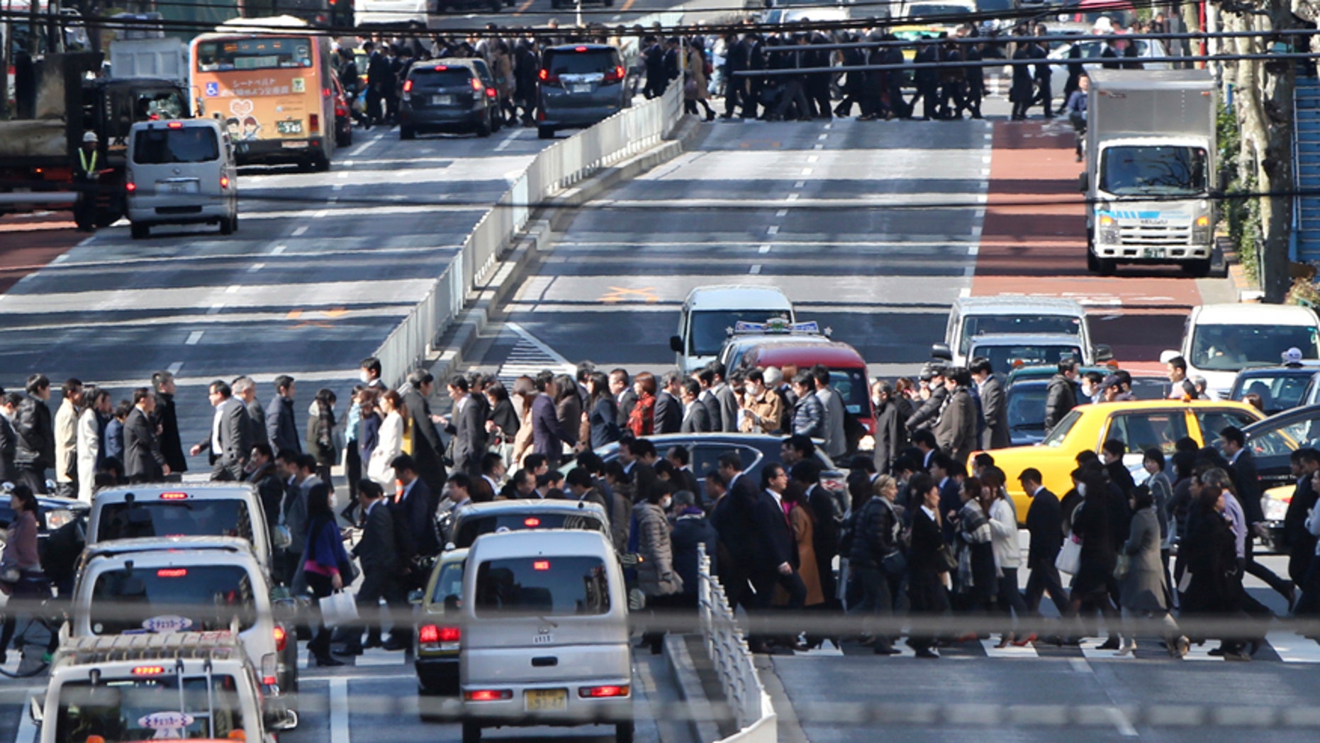 Feb. 26, 2016: People cross crosswalks on a street in Tokyo.