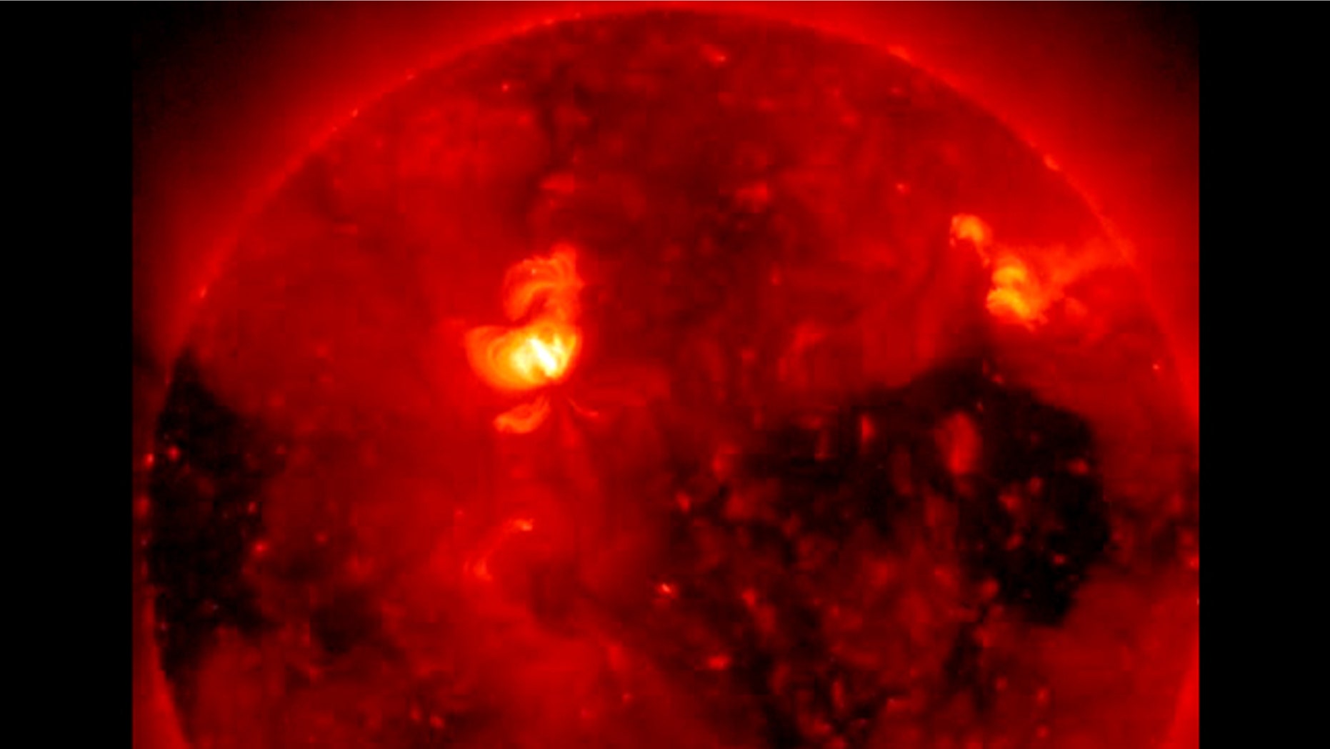 On Feb. 1, 2011, the Hinode satellite captured this breathtaking image of a coronal hole, the dark area seen at the right side of this image. A second, polar coronal hole can also be seen at left.