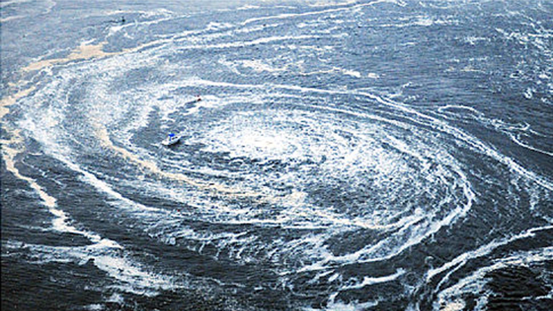 Tsunami swirls near a port in Oarai, Ibaraki Prefecture (state) after Japan was struck by a strong earthquake off its northeastern coast Friday, March 11, 2011.