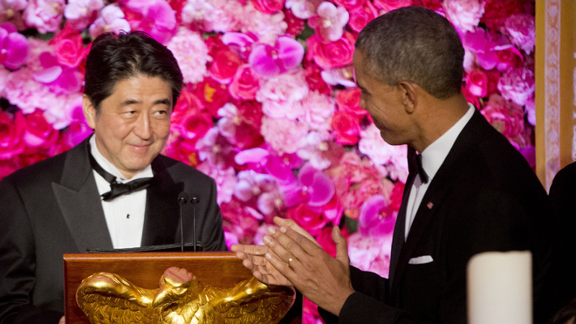 Apr. 28, 2015: President Barack Obama introduces Japanese Prime Minister Shinzo Abe, left, as he host him and Abe's wife Akie Abe, right, at the State Dinner at the White House in Washington.