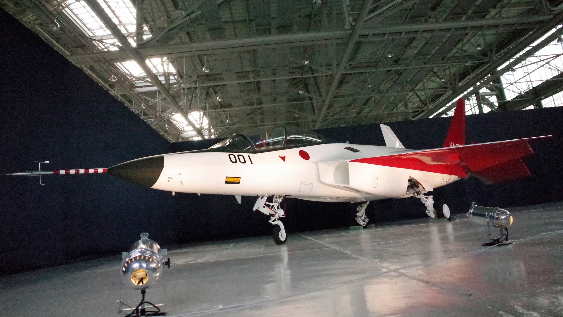 The first domestically-made stealth aircraft, X-2, sits in a hangar at Nagoya Airport in Toyoyama town, central Japan, Thursday, Jan. 28, 2016. The demonstration plane is expected to make its maiden flight sometime after mid-February. A Defense Ministry official said the technology will give Japan the option of developing its own stealth fighter jets in the future. (AP Photo/Emily Wang)
