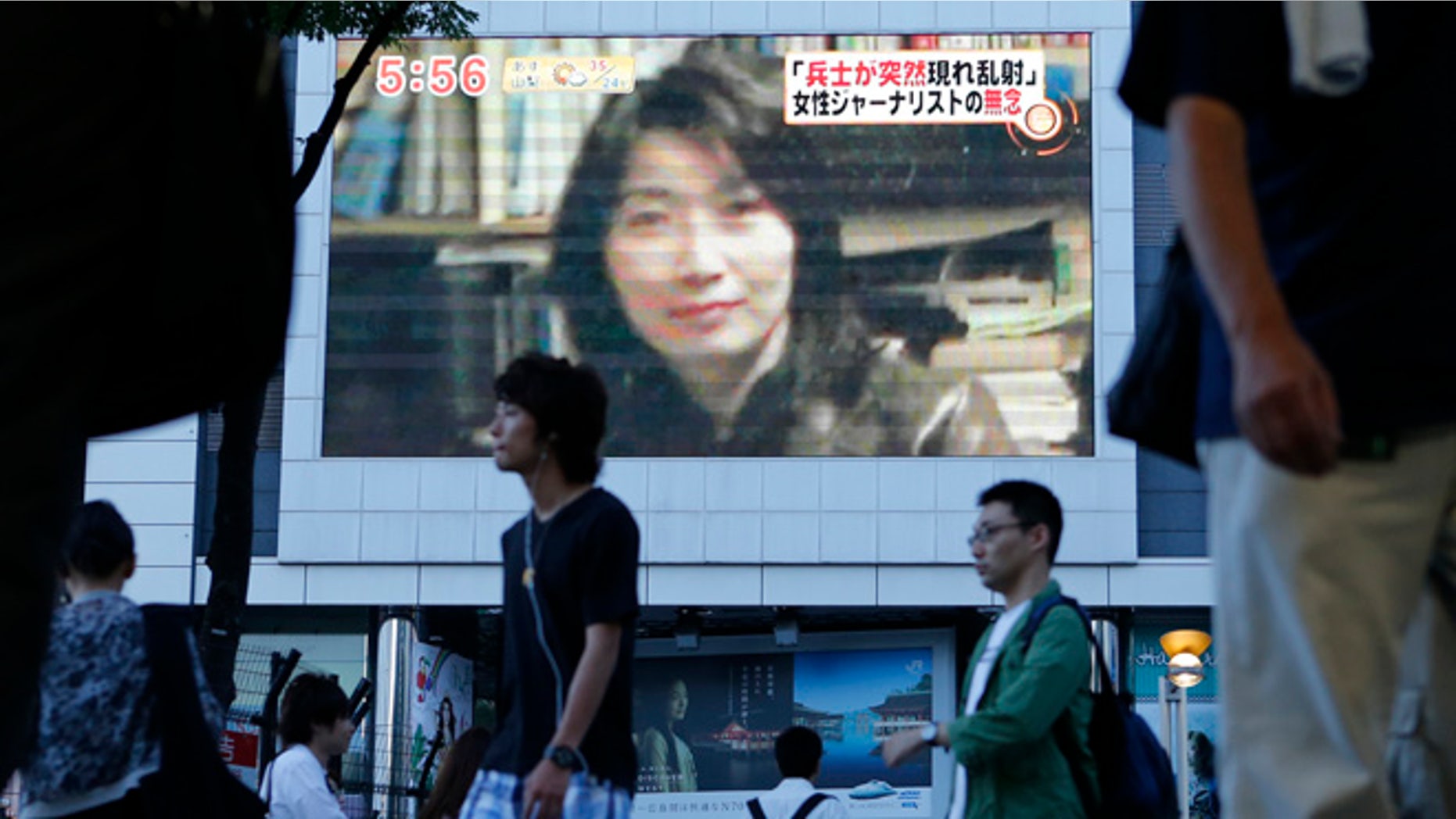 Aug. 21, 2012: An image of Japanese journalist Mika Yamamoto is shown on a large monitor screen in Tokyo during a TV news broadcast reporting her death in Syria.