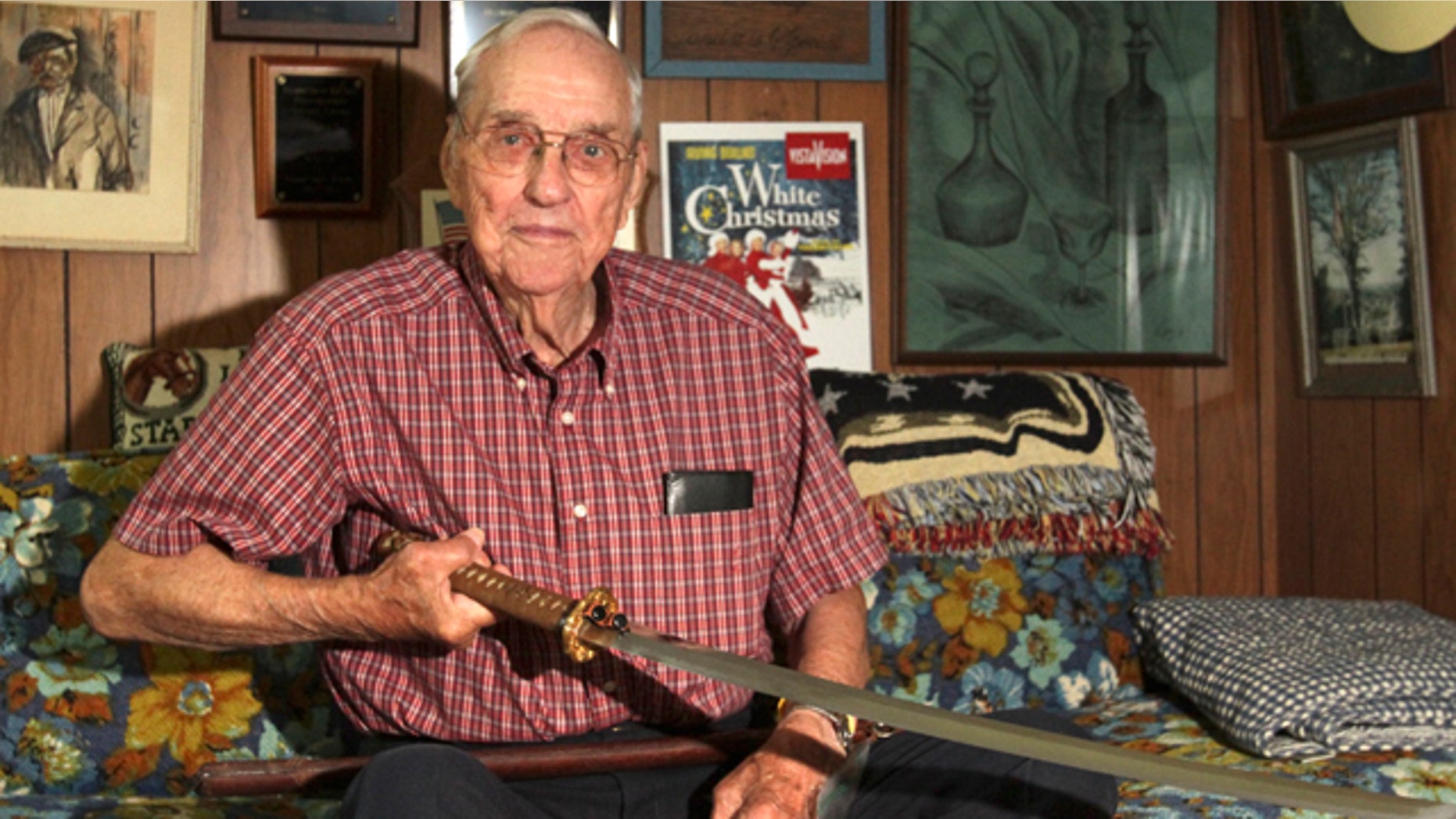 Sept. 10, 2013: Orval Amdahl, 94, of Lanesboro, Minn, holds a sword he took from Japan when he was a captain in the Marines in 1945, at his home in Lanesboro, Minn.