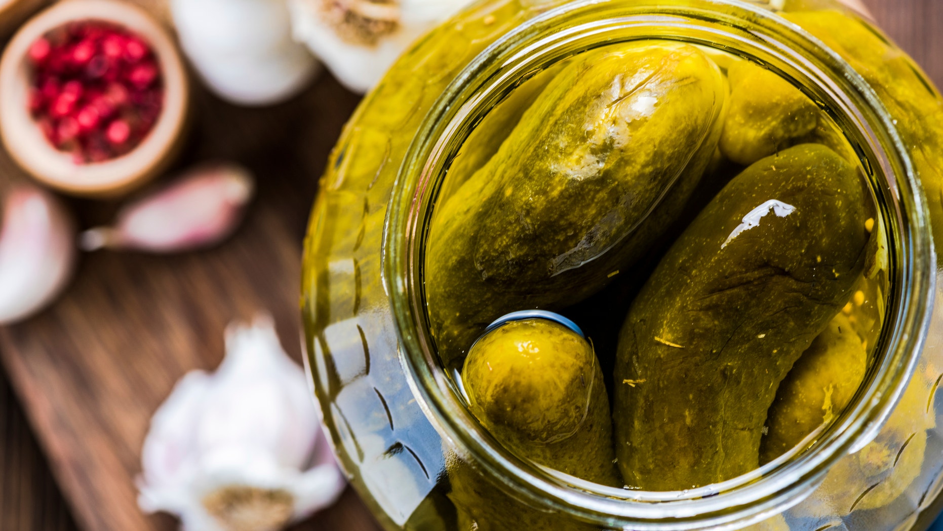 Pickled gherkins in jar, fermented food with spices