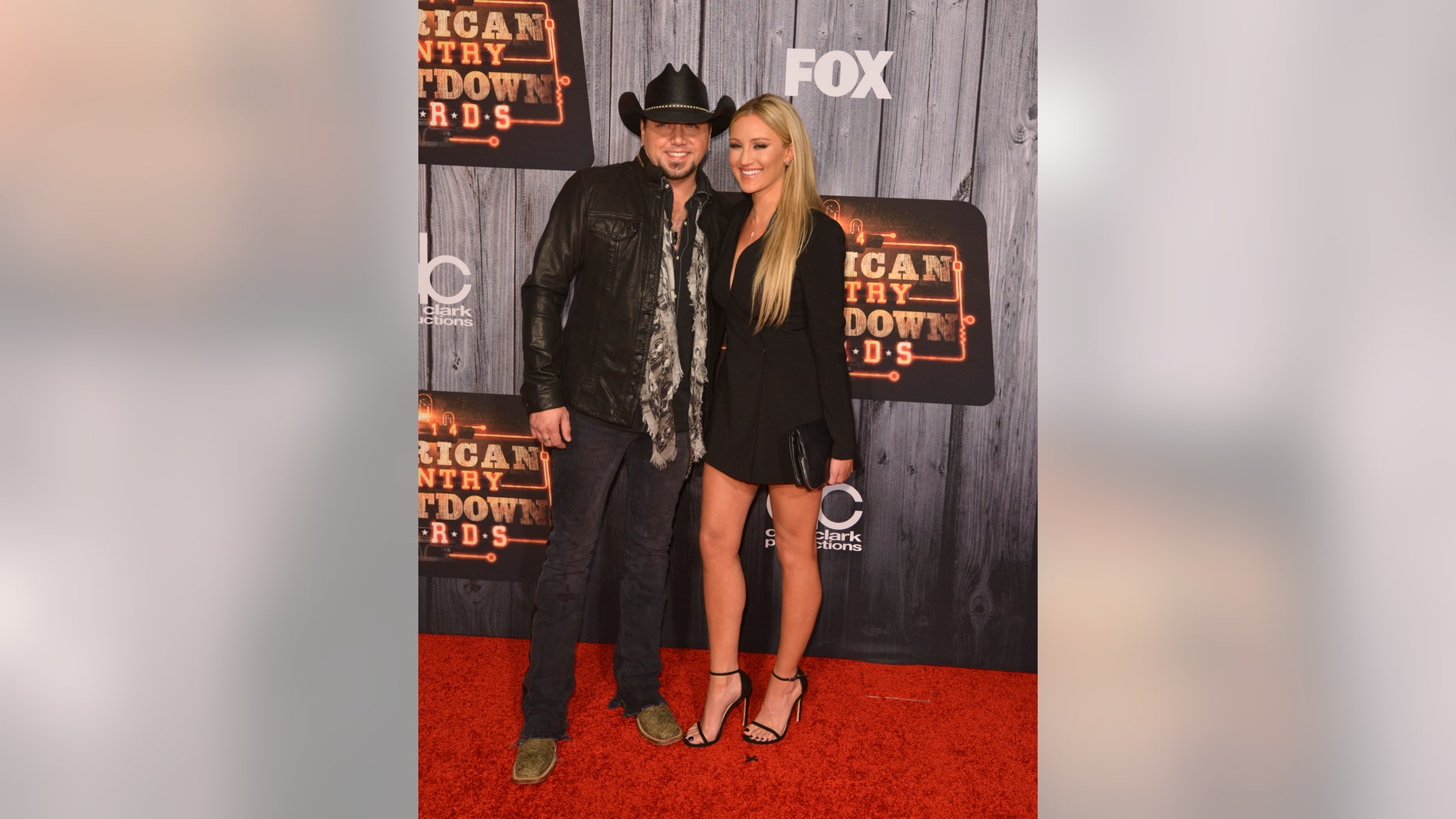 December 15, 2014. Recording artist Jason Aldean and Brittany Kerr arrive at the American Country Countdown Awards in Nashville, Tennessee.