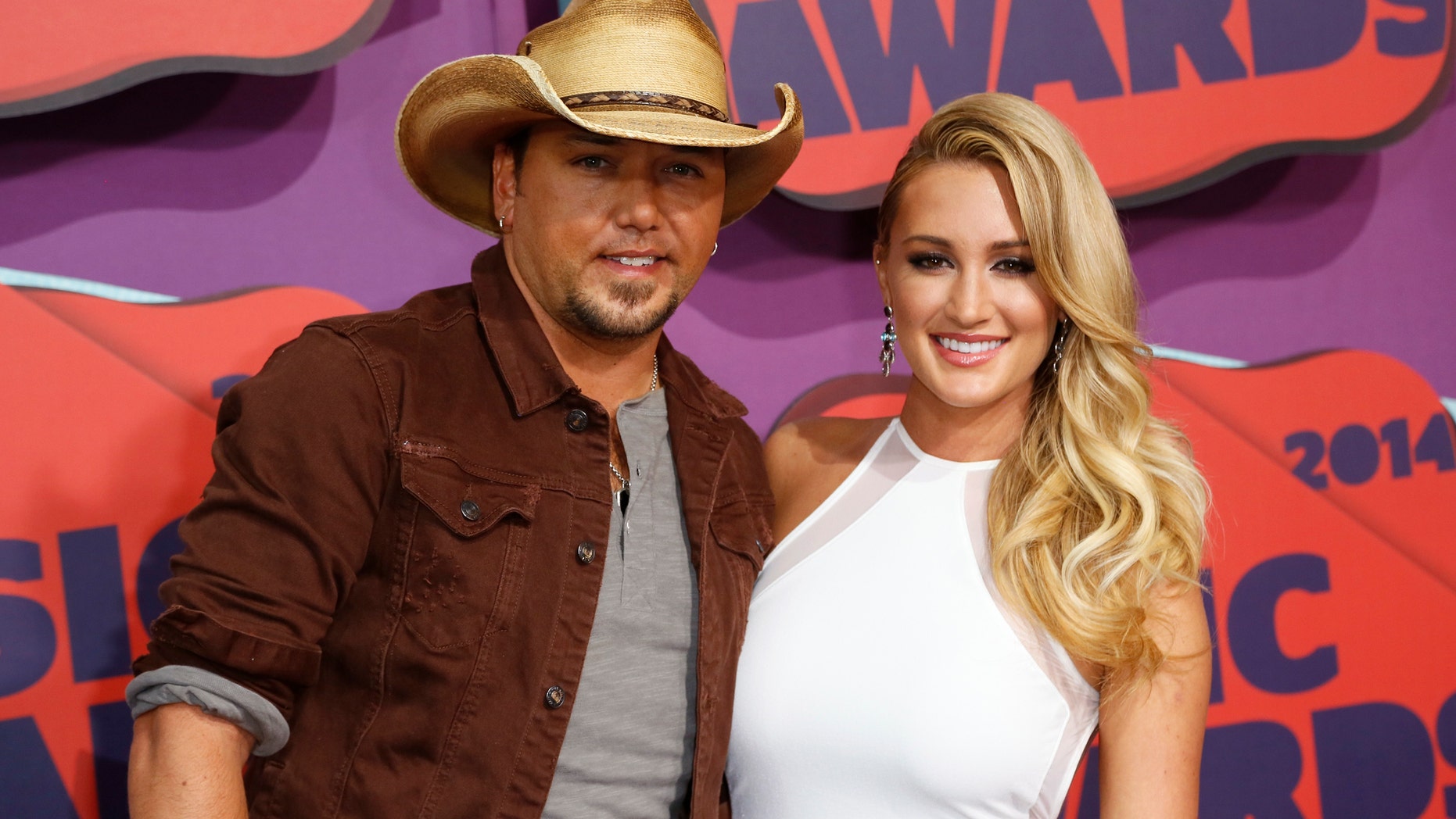 Musician Jason Aldean and Brittany Kerr arrive at the 2014 CMT Music Awards in Nashville, Tennessee June 4, 2014.