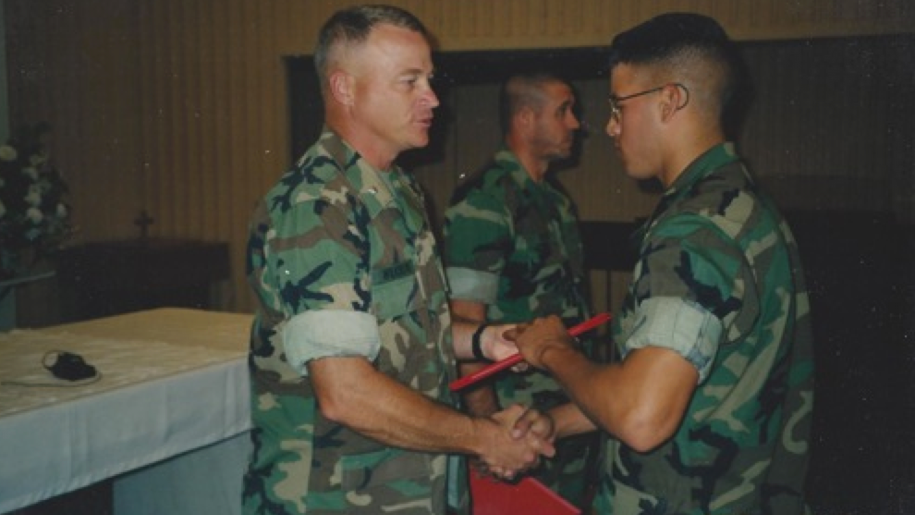 Jason Arwine (right), who served in the U.S. Marines from 1997 to 2005, shakes Lt. Col. Wilkinson's hand at the Marine Corps Air Station in Yuma, Arizona. Arwine was diagnosed with Parkinson's disease in October 2012 and participated in the Parkinson Voice Project about two years ago.