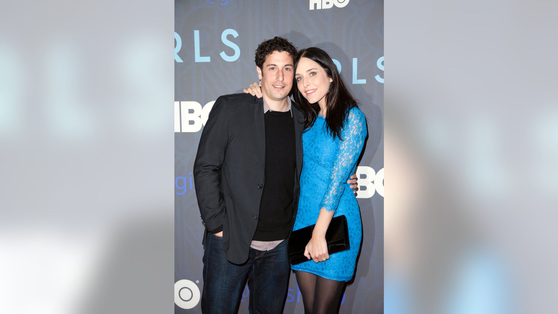 Actor Jason Biggs and wife Jenny Mollen attend the Season 2 premiere of the television series "Girls" in New York January 9, 2013.