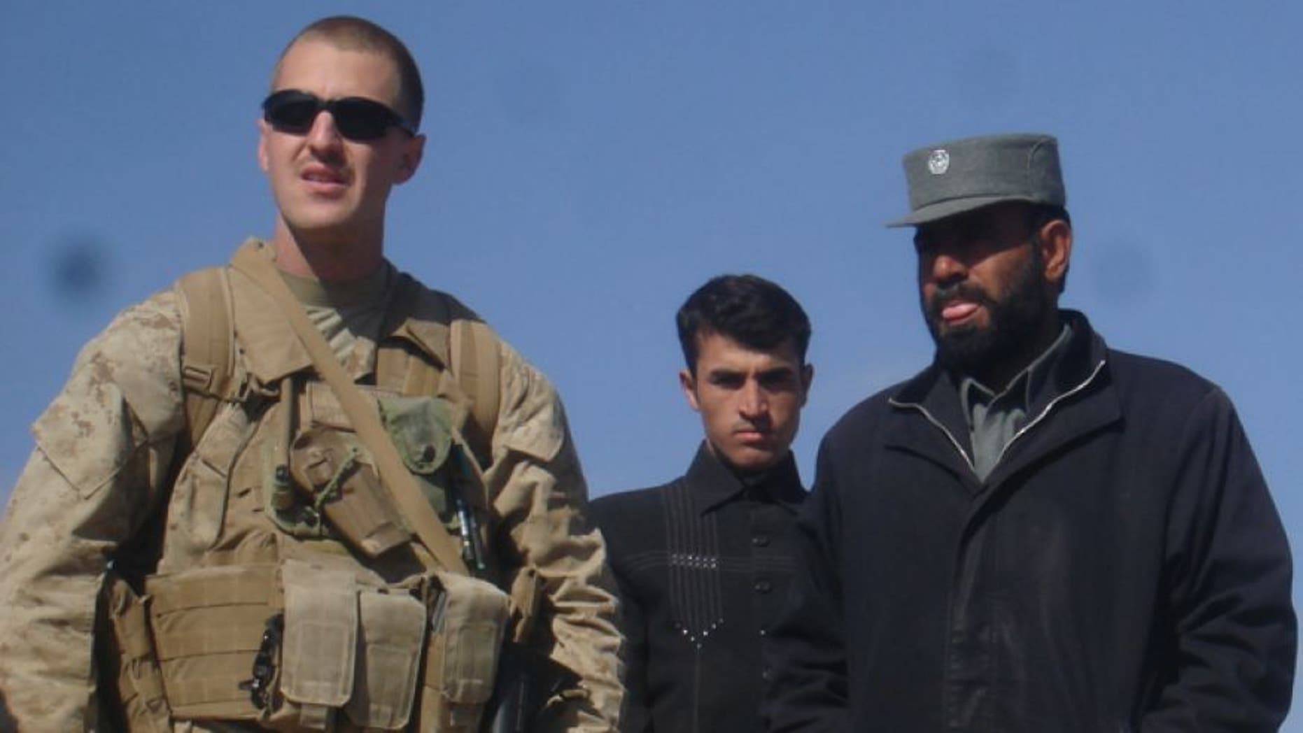 Shown here is Marine reservist Jason Brezler, left. At right is Sarwar Jan, an Afghan police official whom Brezler warned his fellow Marines about.