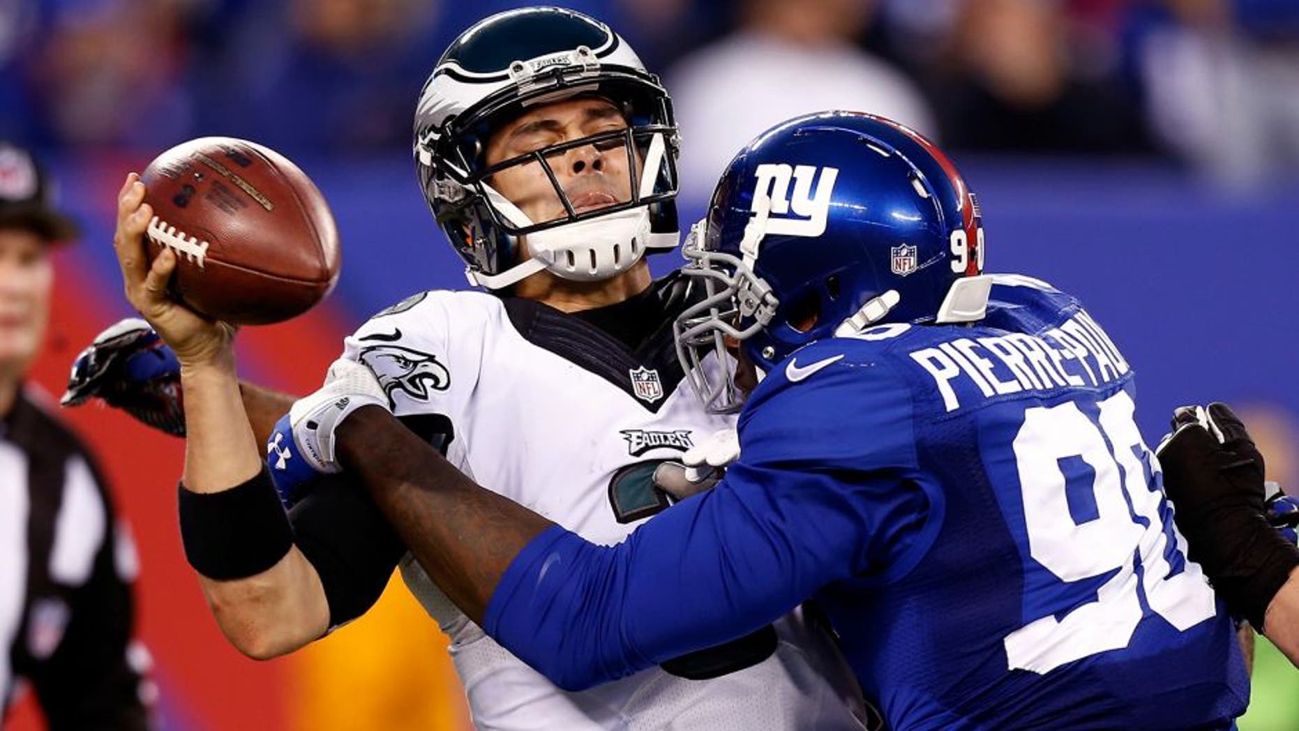 EAST RUTHERFORD, NJ - DECEMBER 28: Jason Pierre-Paul #90 of the New York Giants sacks Mark Sanchez #3 of the Philadelphia Eagles during a game at MetLife Stadium on December 28, 2014 in East Rutherford, New Jersey. (Photo by Jeff Zelevansky/Getty Images)