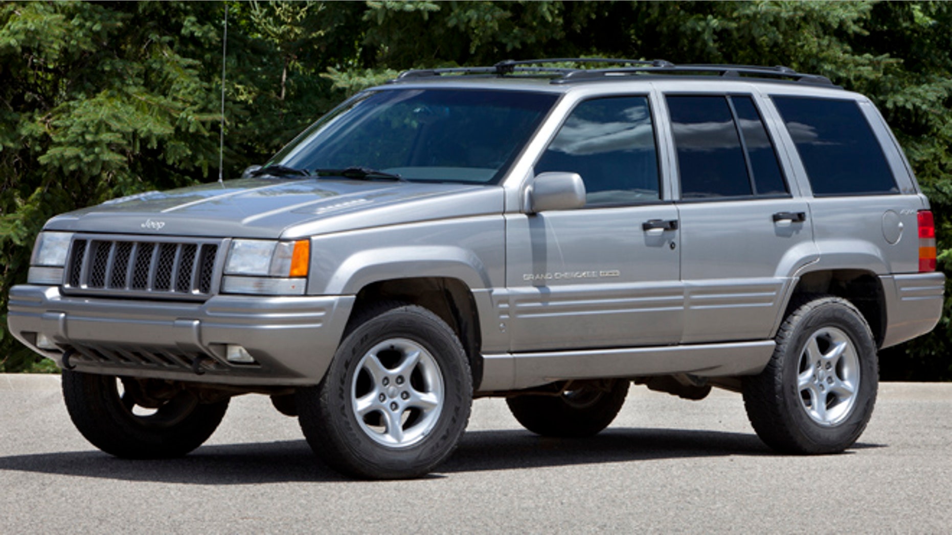 This undated photo provided by Chrysler shows a 1998 Jeep Grand Cherokee. The National Highway Traffic Safety Administration says on its website that it has added Jeep Liberty and Cherokee SUVs to the investigation. The probe now covers 5.1 million vehicles. The agency says 15 people have died in 26 Grand Cherokee fires. The investigation affects 1993 to 2004 Grand Cherokees. Also covered are 1993-2001 Cherokees and 2002-2007 Liberty's. (AP Photo/Chrysler)