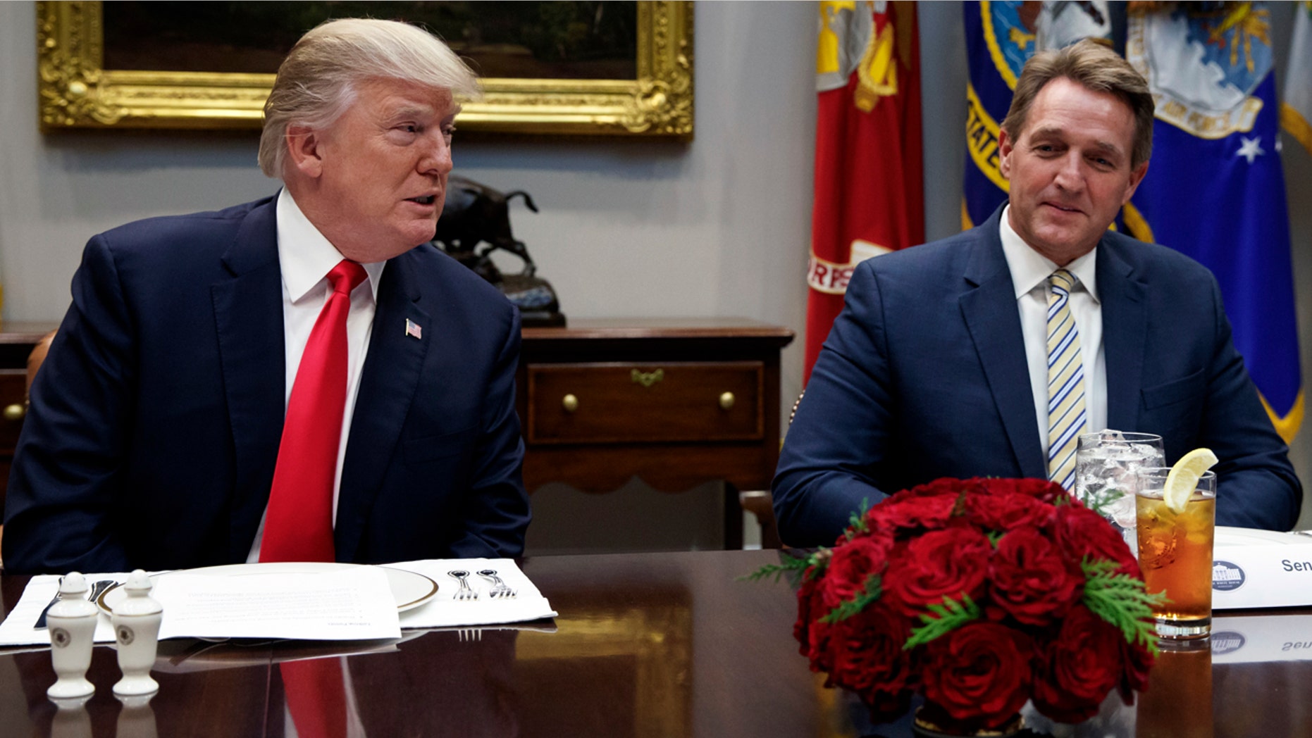 Sen. Jeff Flake, R-Ariz., joins President Trump at the White House Tuesday.