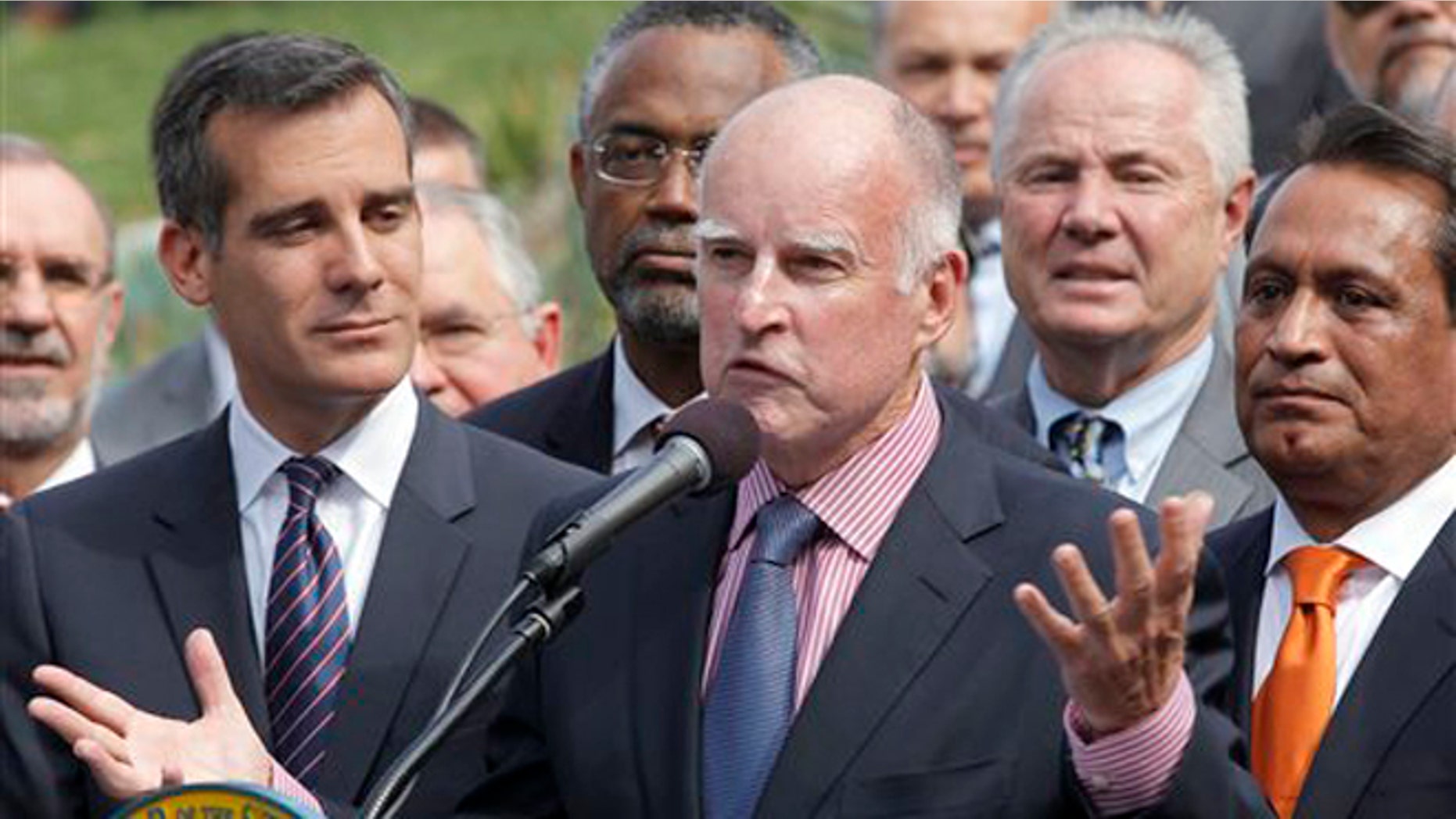 California Gov. Jerry Brown speaks at Los Angeles City Hall before signing the AB 60 bill in Los Angeles Thursday, Oct 3, 2013. The bill adds California to the growing list of states allowing immigrants in the country illegally to obtain driver licenses. (AP Photo/Nick Ut)