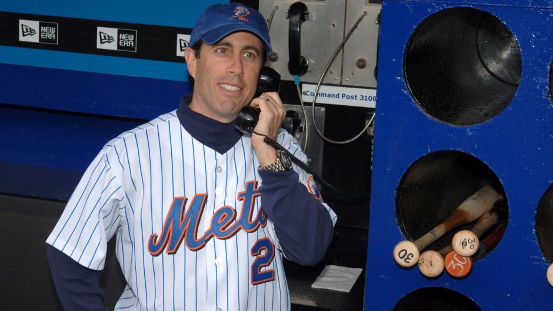 Jerry Seinfeld during Jerry Seinfeld Throws The First Pitch at The Mets/Yankees Subway Series Game to Promote The Release of the "Seinfeld" Season 4 DVD at Shea Stadium in New York City, New York, United States. (Photo by Stephen Lovekin/WireImage)
