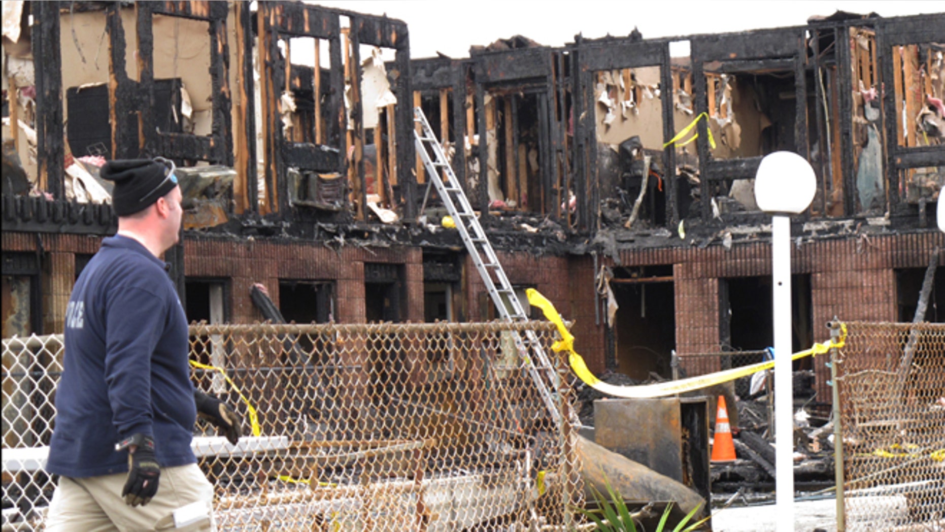March 22, 2014: Investigators go through the rubble of a motel in Point Pleasant Beach N.J.