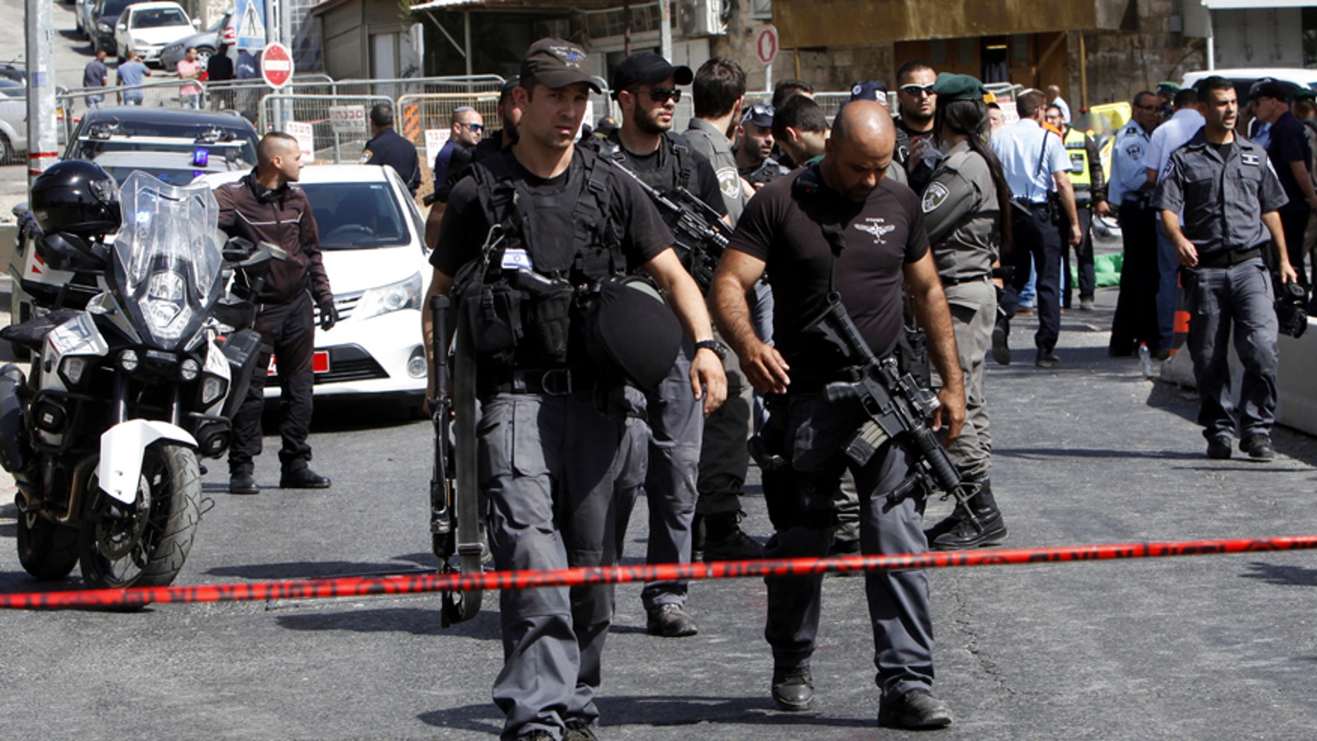 Oct. 9, 2016: Israeli police secures the scene where a car driven by a Palestinian gunman was intercepted by the police and gunman shot dead in Jerusalem.