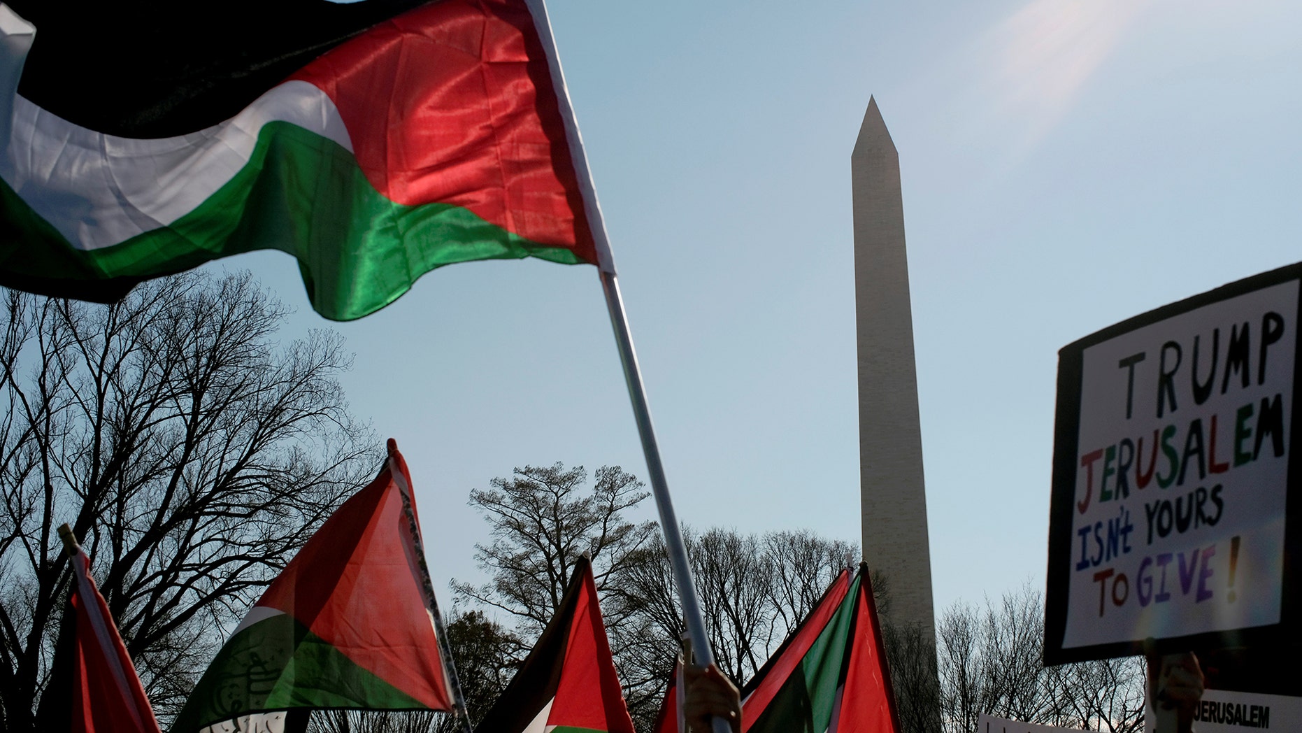 Protesters with Palestinian flags demonstrate after President Trump announced plans to move the US embassy in Israel to Jerusalem.
