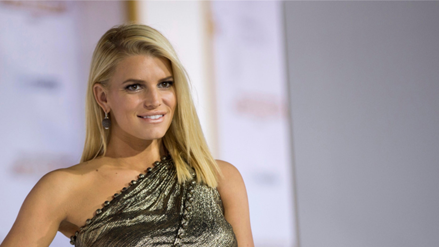 November 21, 2014. Actress Jessica Simpson poses at the premiere of "The Hunger Games: Mockingjay - Part 1"; in Los Angeles, California.