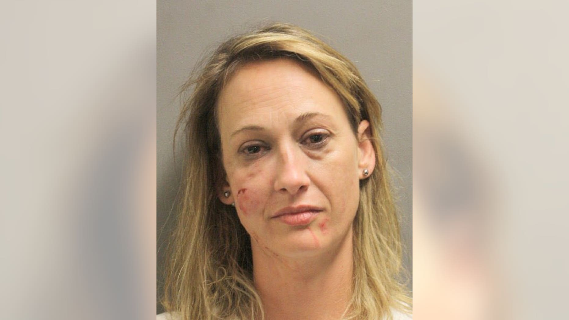 Jessica Collins, 41, is accused of biting another woman's nose and swallowing a chunk of it.