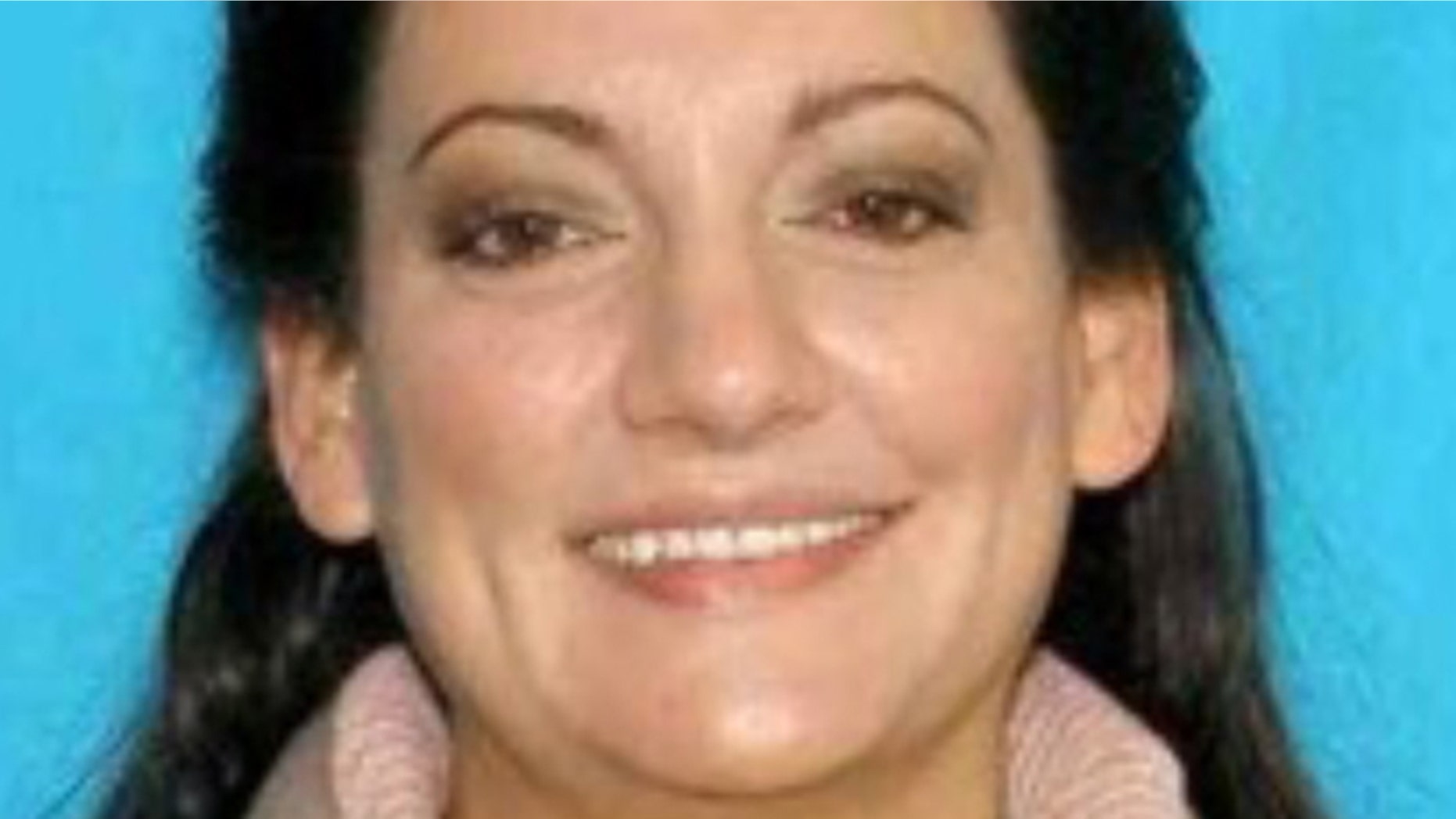 This image provided by Cannon Beach Wash. Police Department shows an undated photo of Jessica Smith, 40. A hotel housekeeper discovered an injured 13-year-old girl and the body of her 2-year-old sister at an inn on the Oregon Coast on Friday,Aug. 1, 2014 and police were searching for their mother.