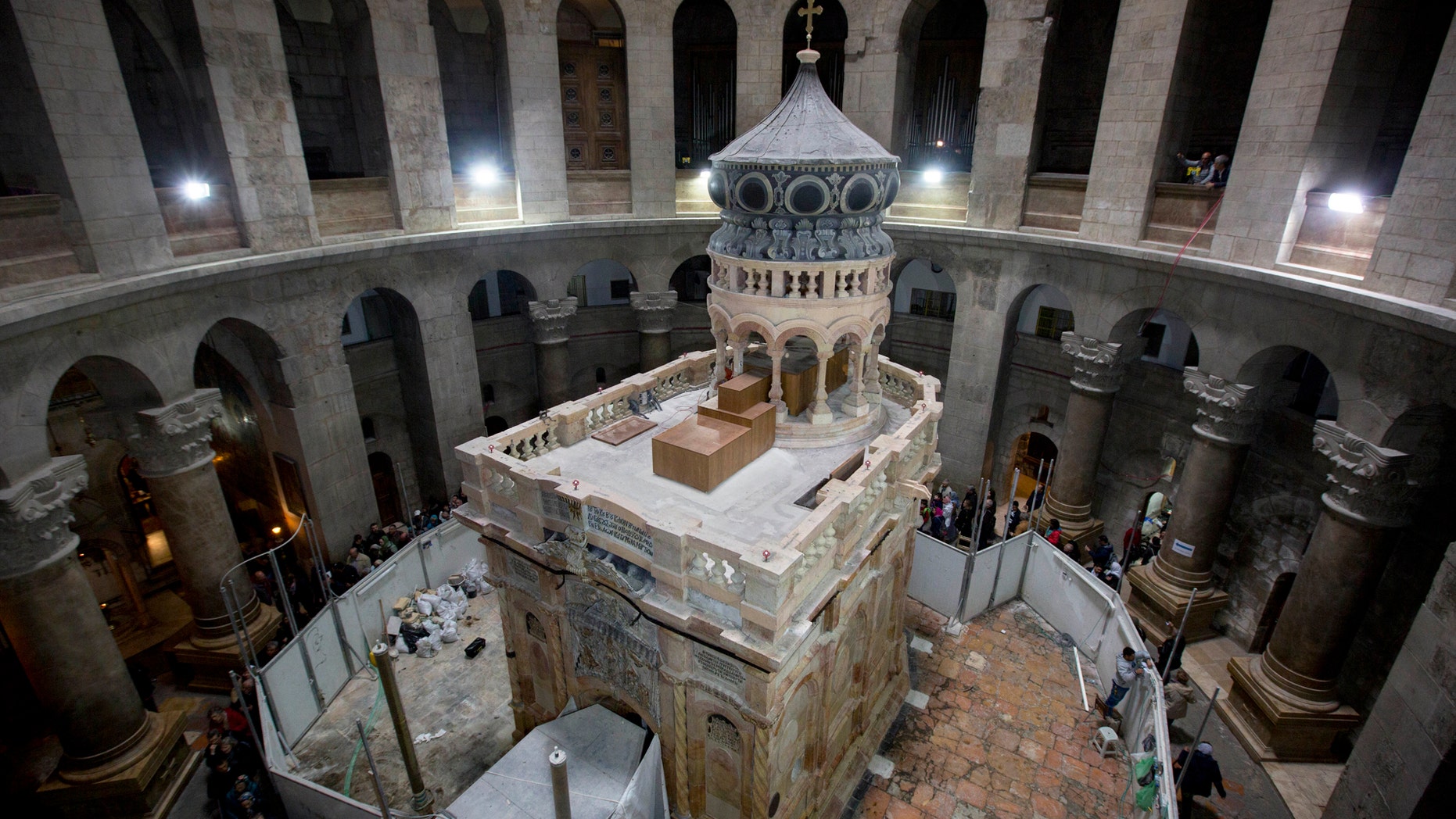 The renovated Edicule is seen in the Church of the Holy Sepulchre, traditionally believed to be the site of the crucifixion of Jesus Christ, in Jerusalem's old city Monday, Mar. 20, 2017. A Greek restoration team has completed a historic renovation of the Edicule, the shrine that tradition says houses the cave where Jesus was buried and rose to heaven. (AP Photo/Sebastian Scheiner)